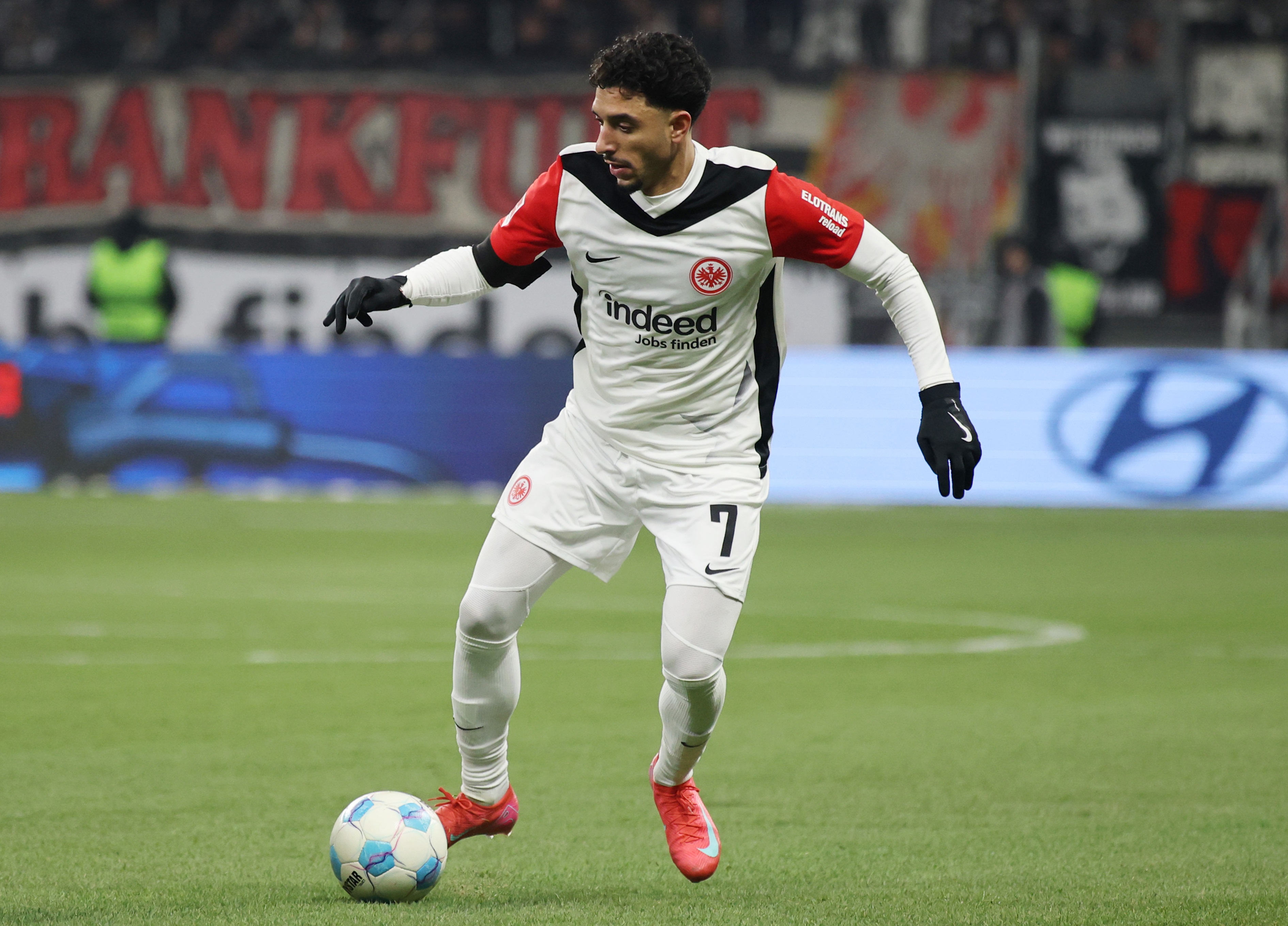 Former Liverpool target Omar Marmoush dribbles with the ball for Frankfurt.