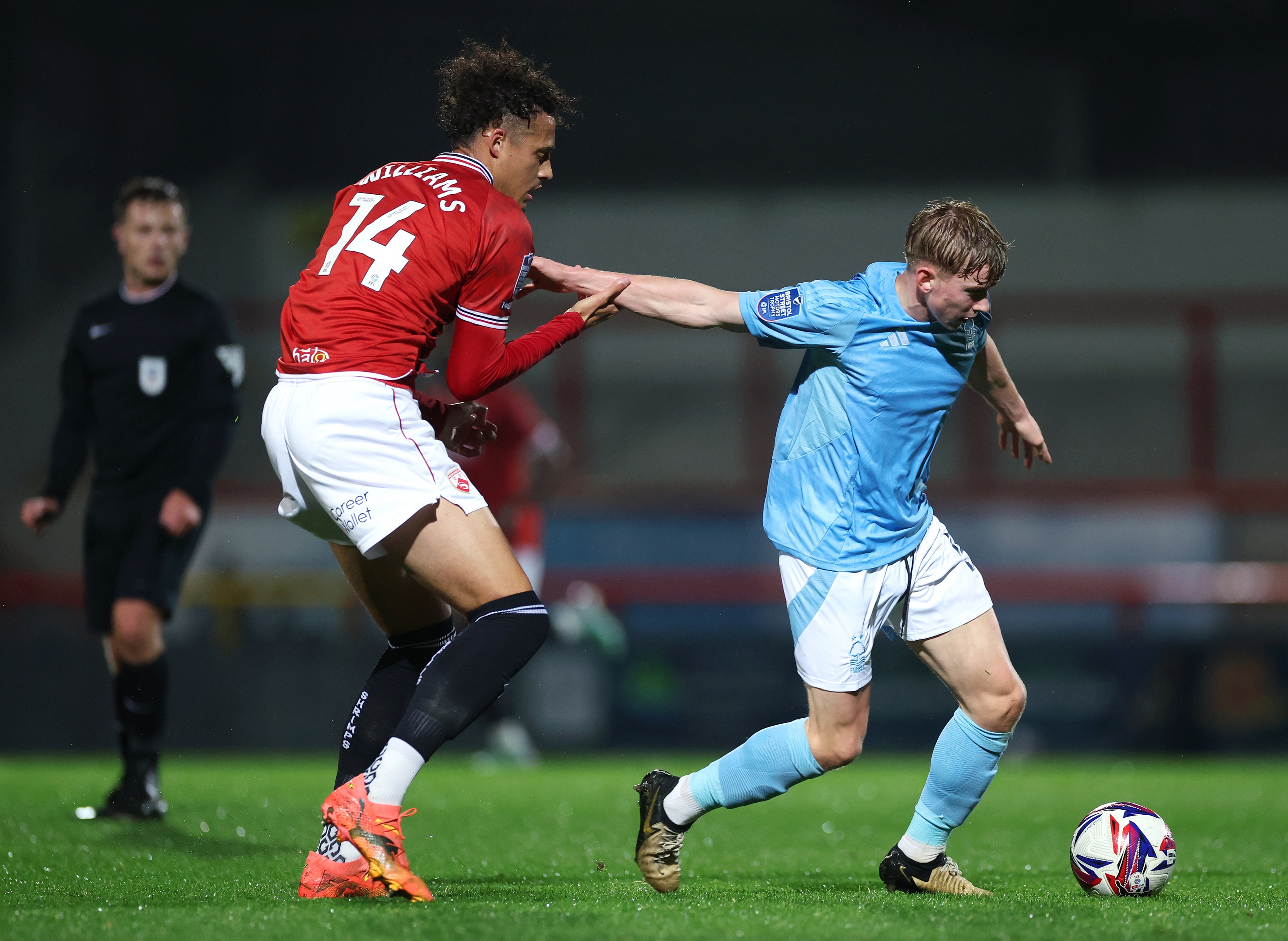 Rhys Williams challenges Nottingham Forest footballer Jack Perkins for the ball.