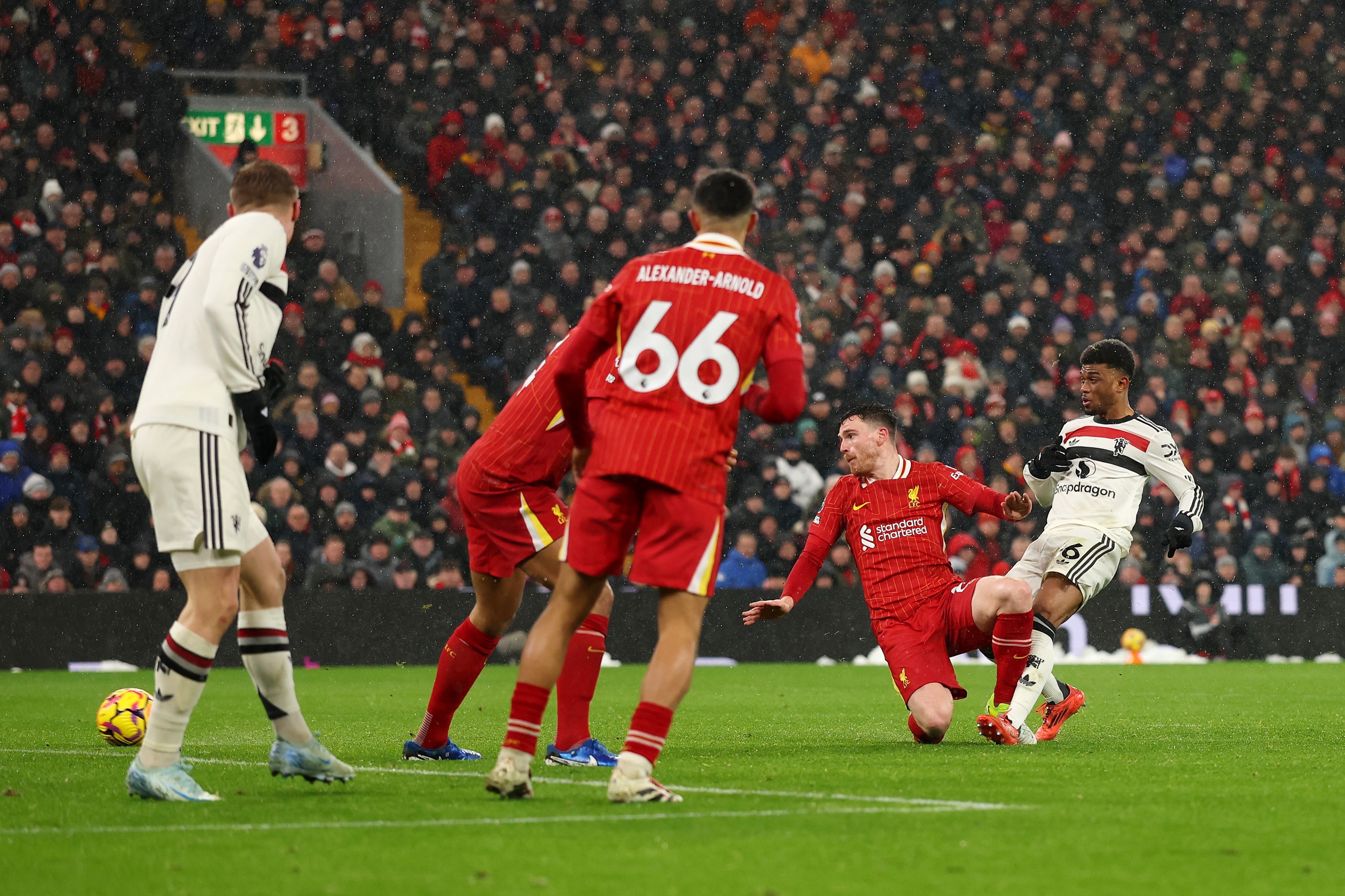 Trent Alexander-Arnold watches on as Amad Diallo scores against Liverpool.