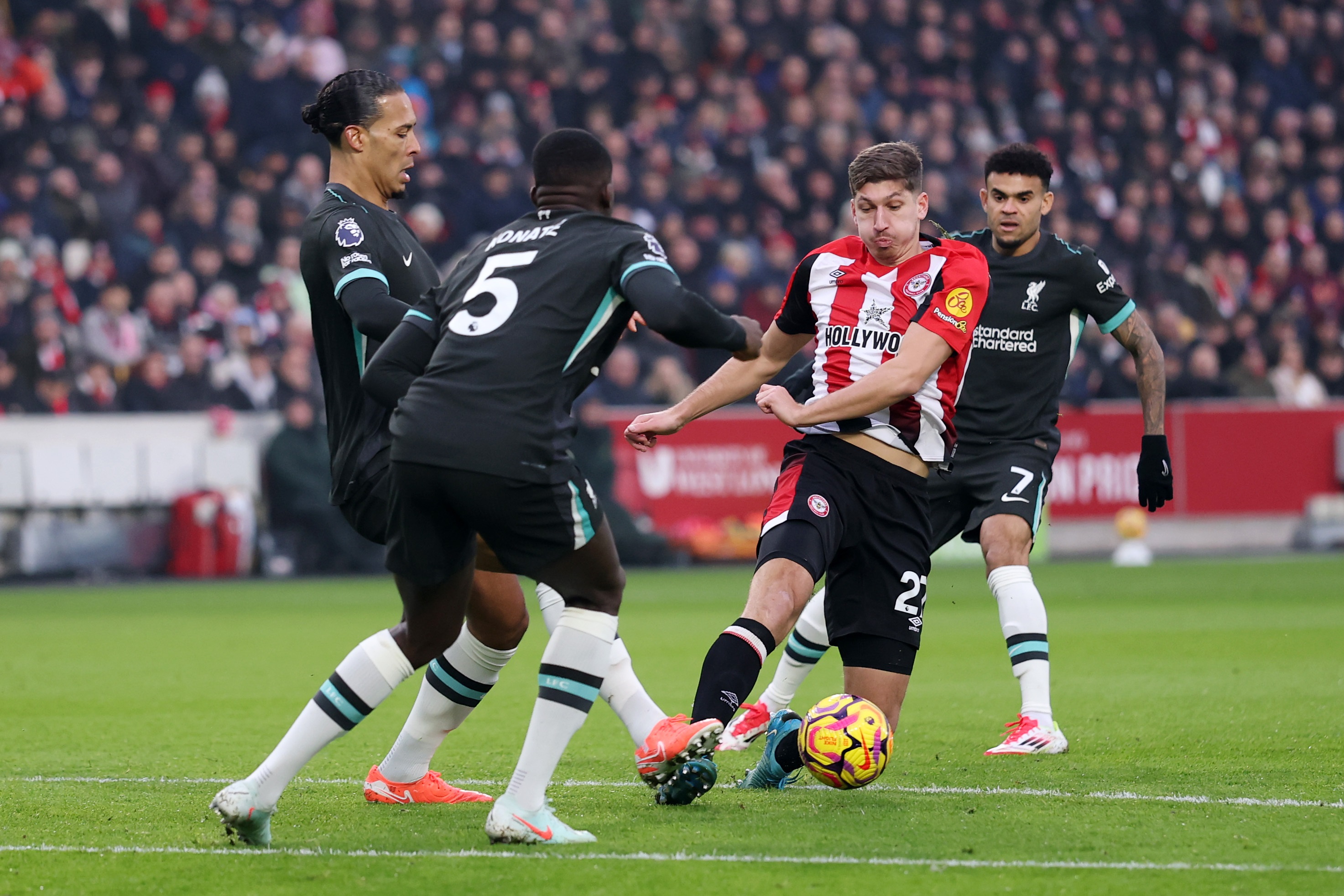 Virgil van Dijk and Ibrahima Konate press Brentford midfielder Vitaly Janelt.