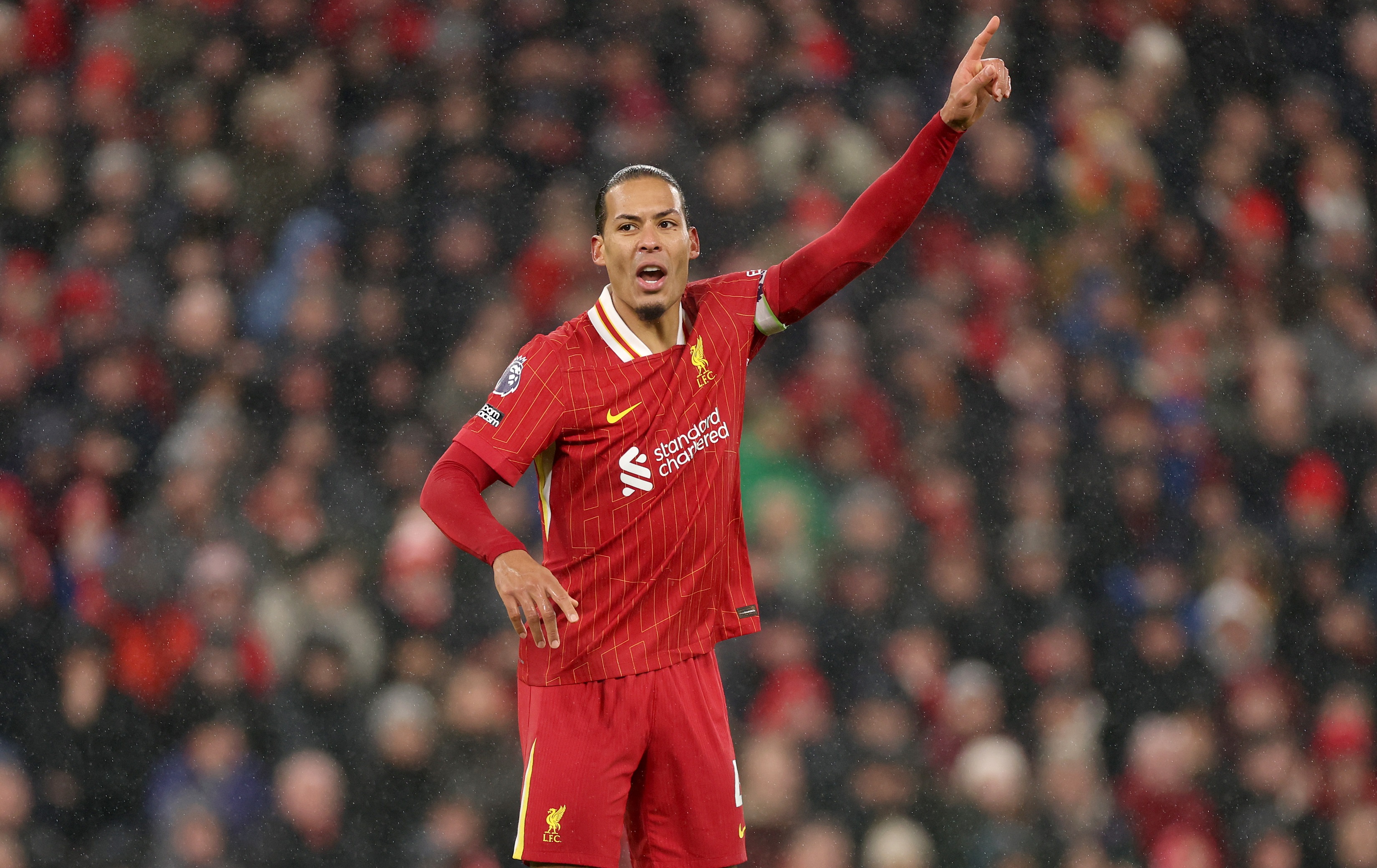 Virgil van Dijk holds up his arm at Anfield during Liverpool v Manchester United.