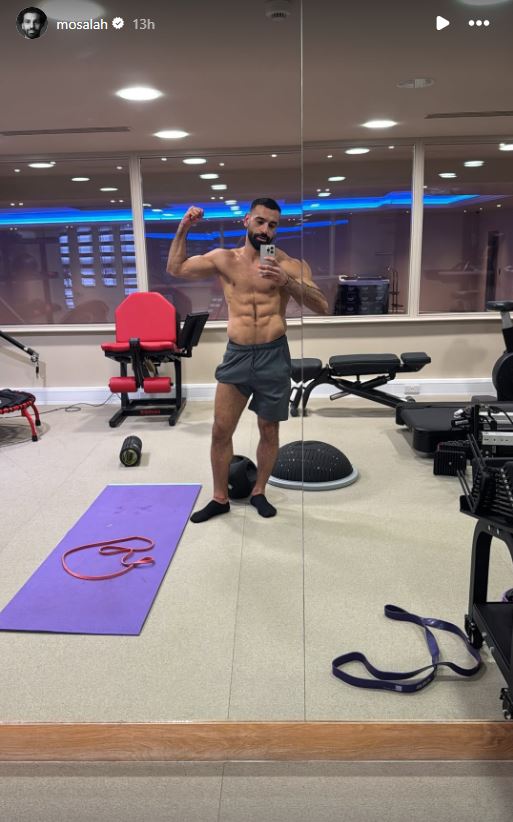 Mo Salah poses in the gym after a workout