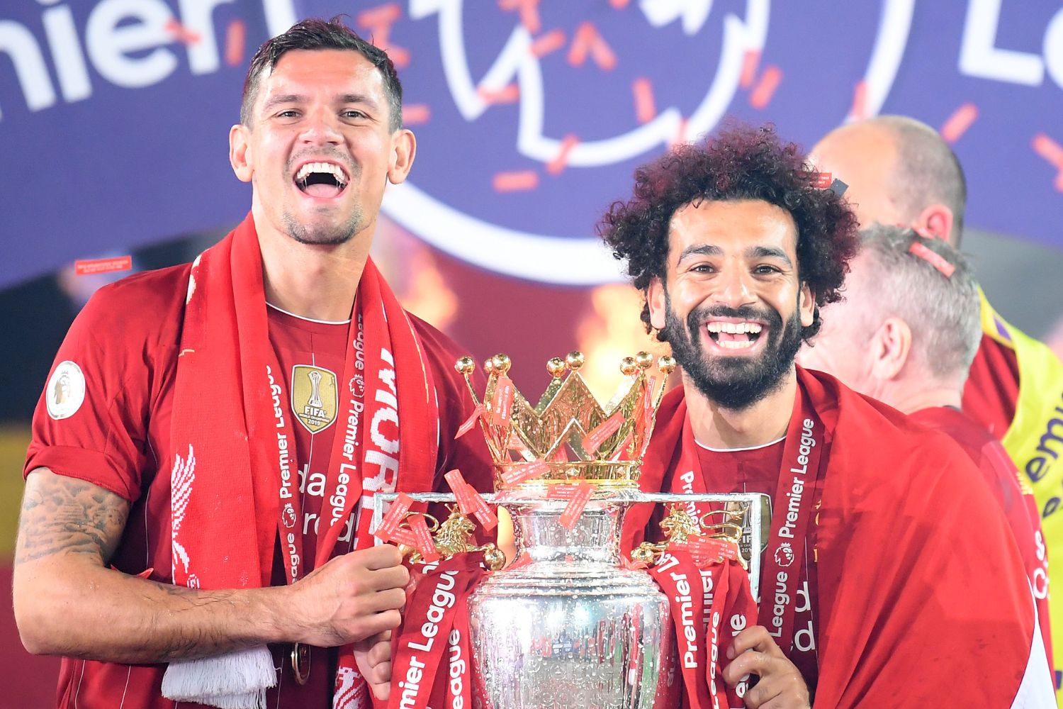 Mo Salah and Dejan Lovren pose with the Premier League trophy