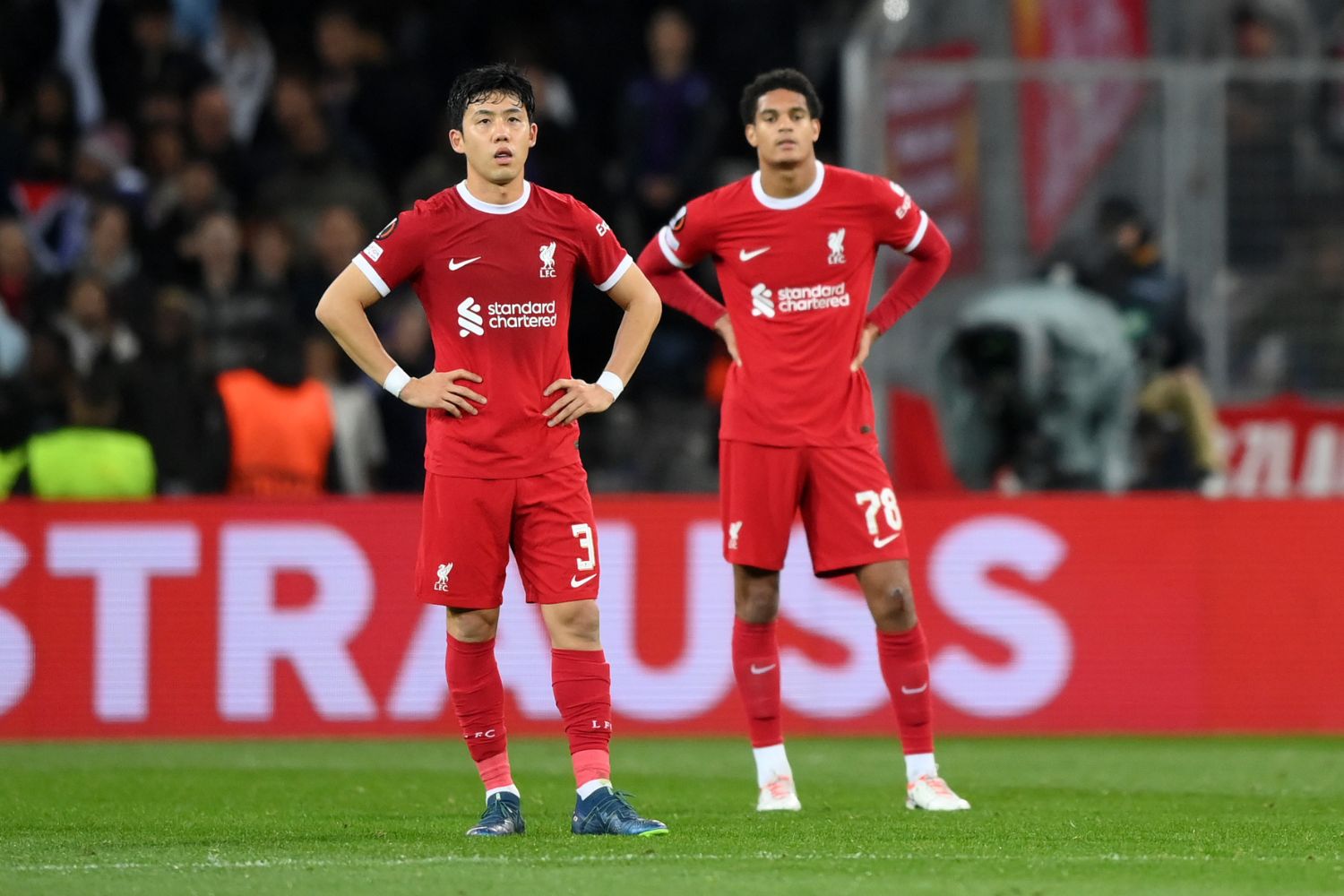 Jarell Quansah and Wataru Endo in action for Liverpool