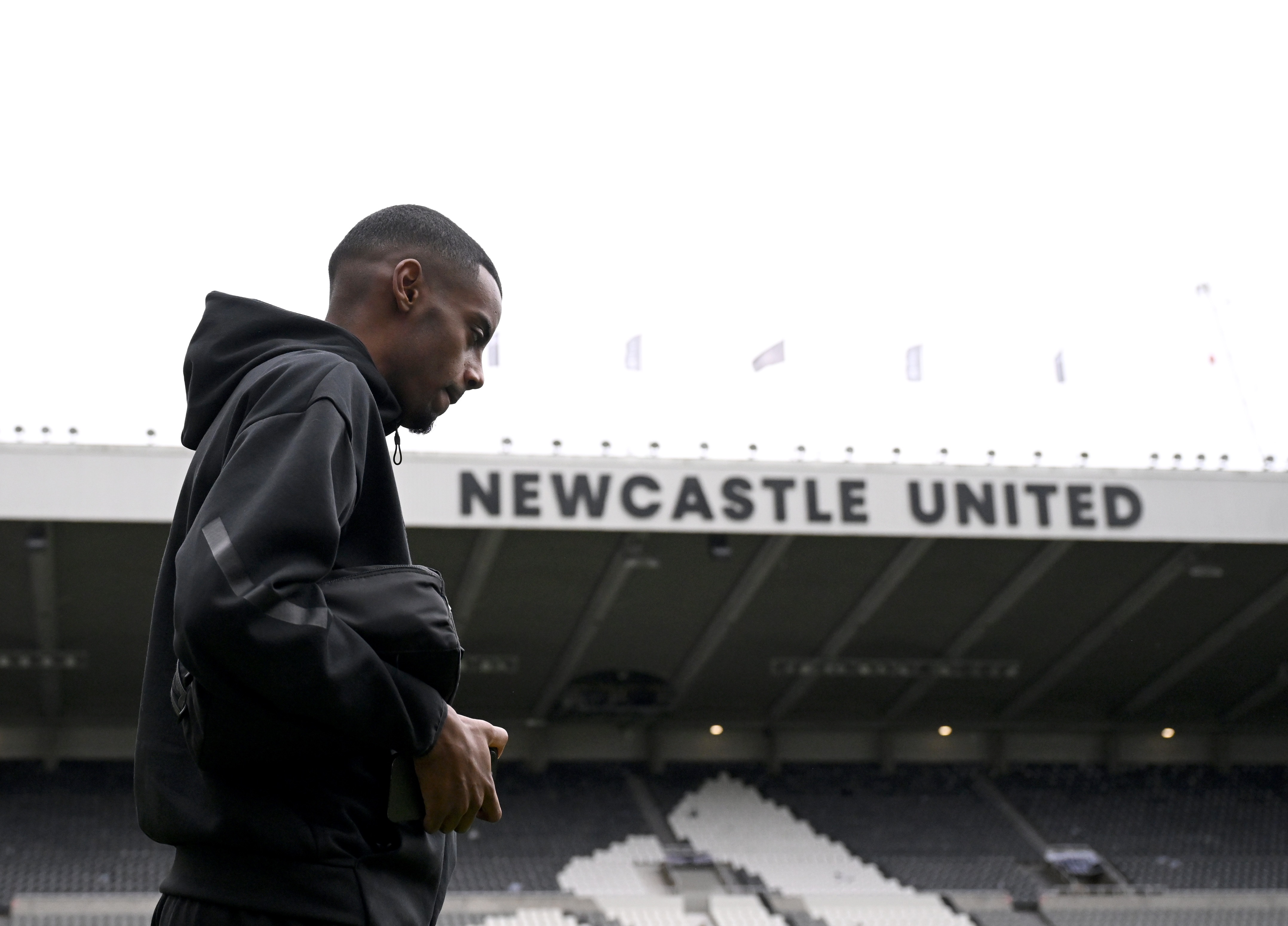 Alexander Isak walks in sight of St James Park stadium.