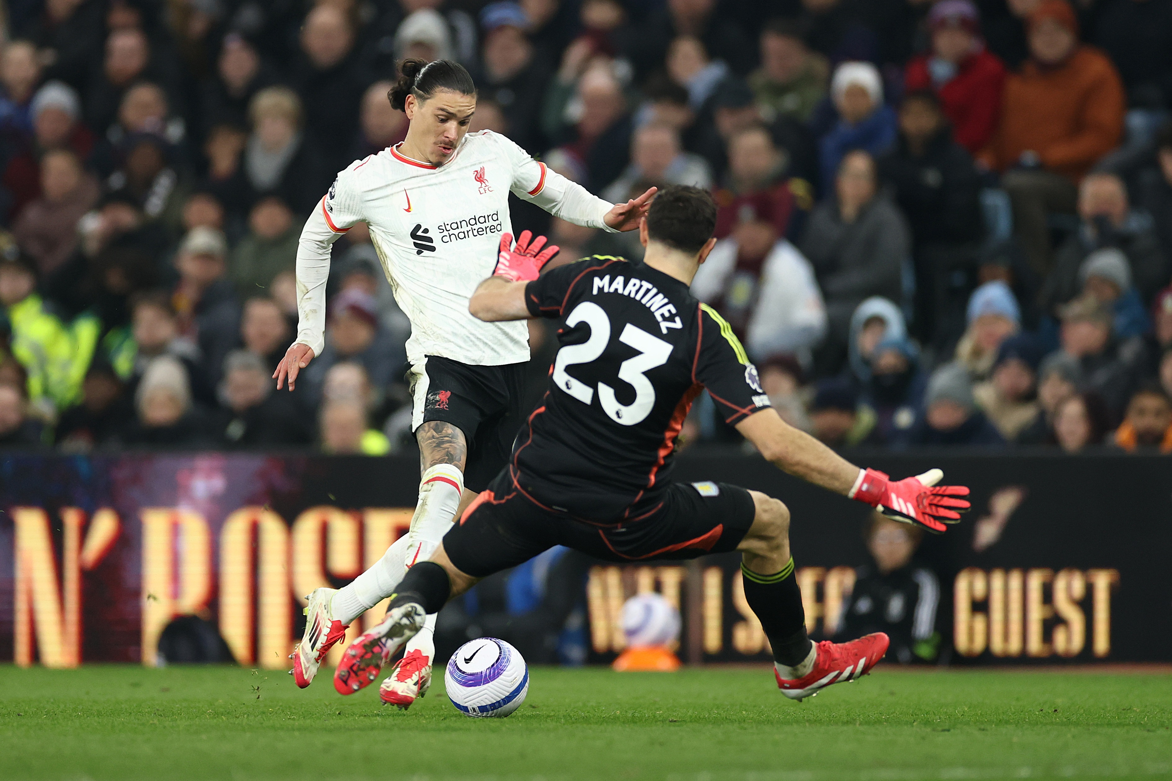 Darwin Nunez attempts to beat Emi Martinez at Villa Park.