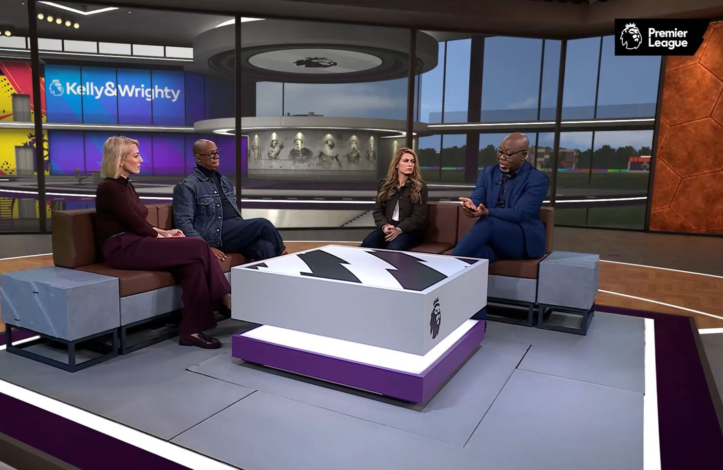 Ian Wright sitting on a couch on a panel show with the Premier League.