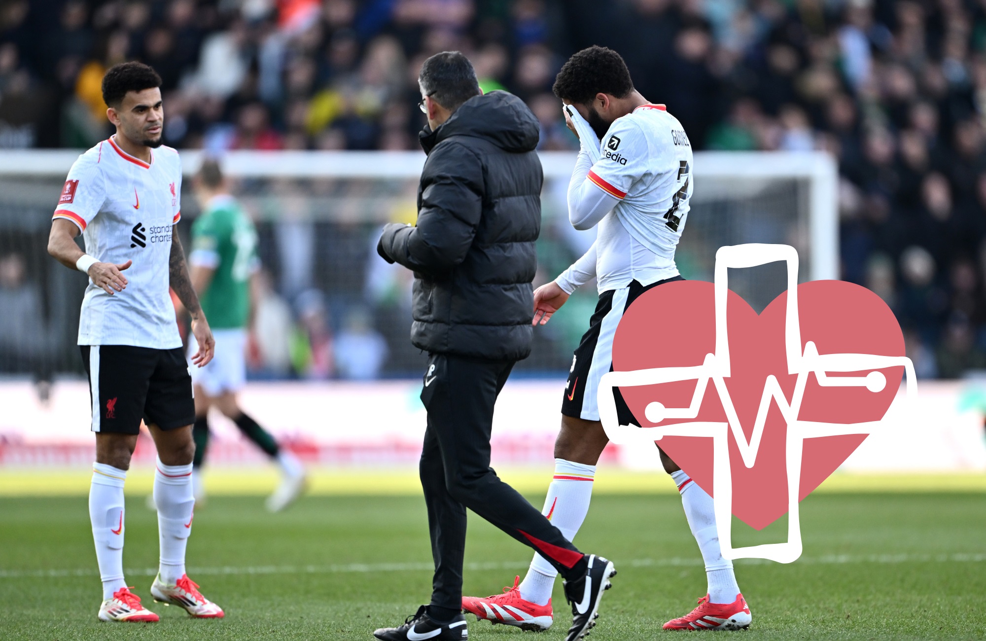 Joe Gomez covers his face with his shirt walking off the pitch.