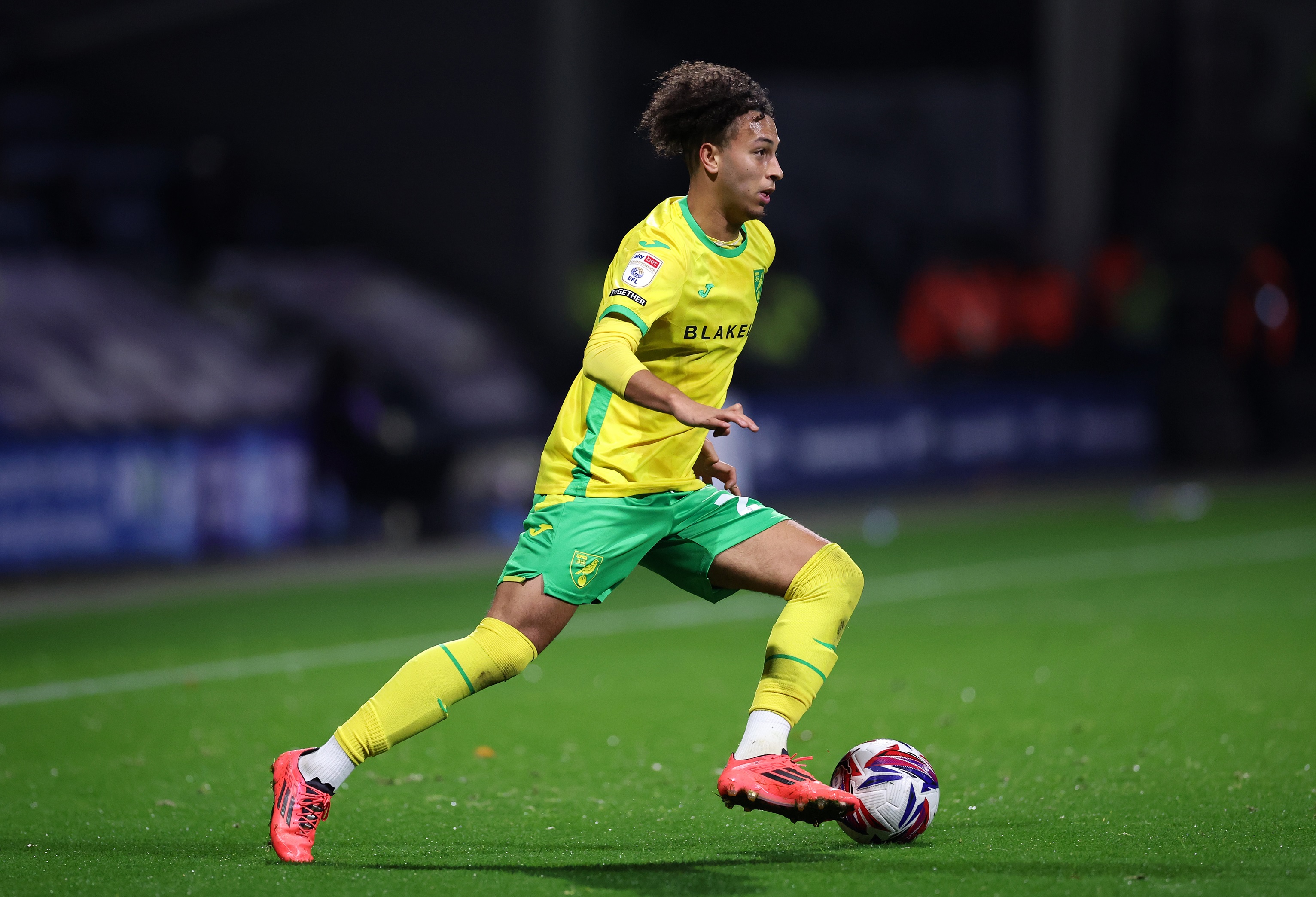 Kaide Gordon dribbles with the ball for Norwich.