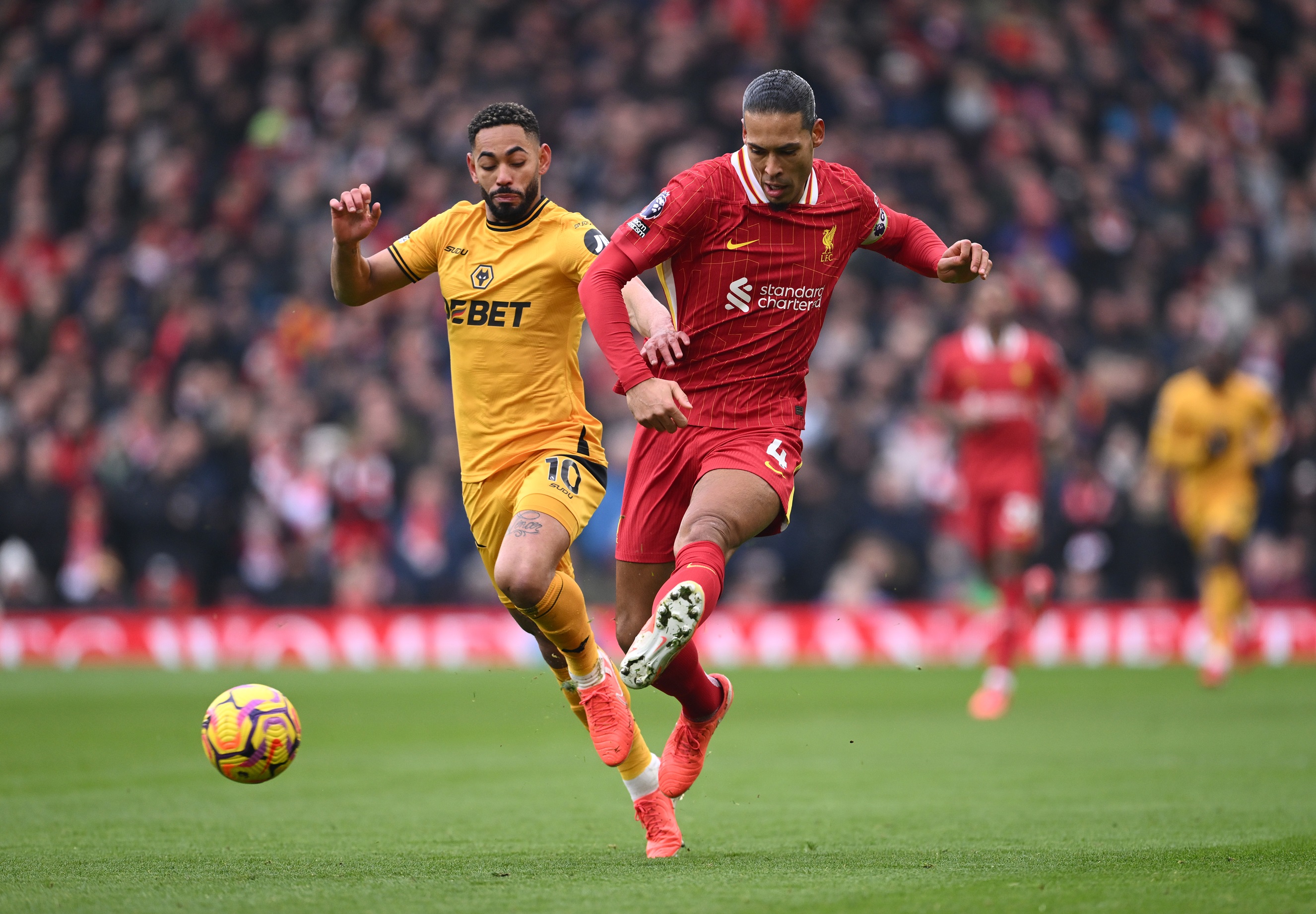 Virgil van Dijk passes the ball during Liverpool v Wolves match.