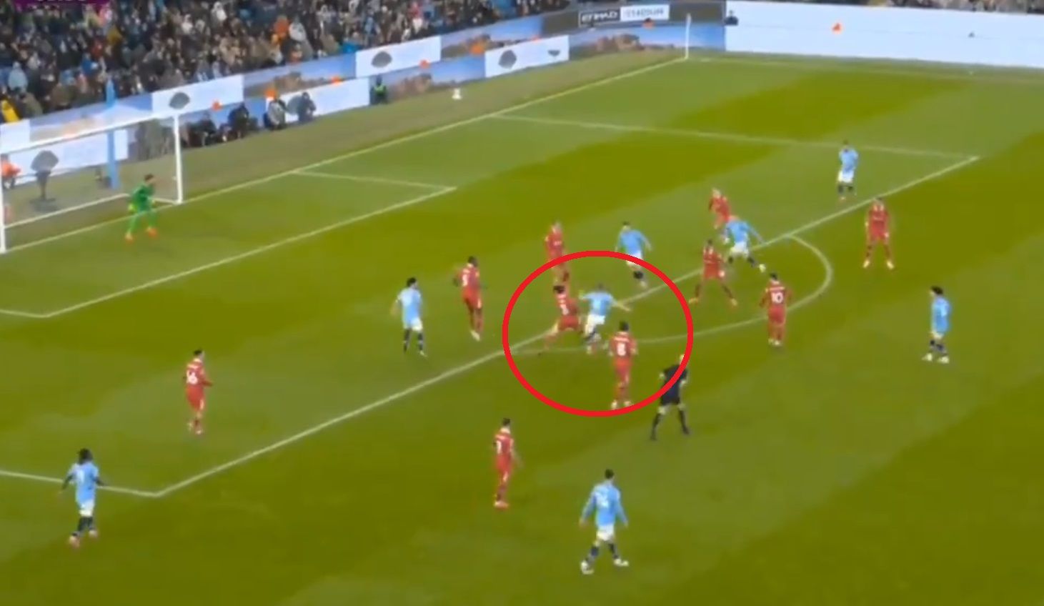 Wataru Endo tackles Manchester City player outside Liverpool box.