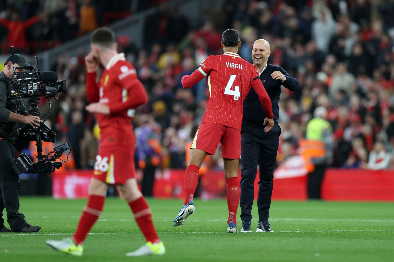 Virgil van Dijk celebrates with Arne Slot at Anfield