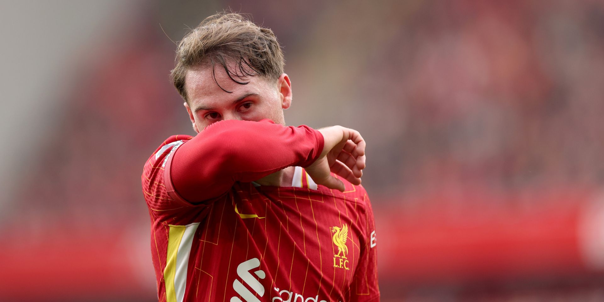 Alexis Mac Allister playing for Liverpool at Anfield