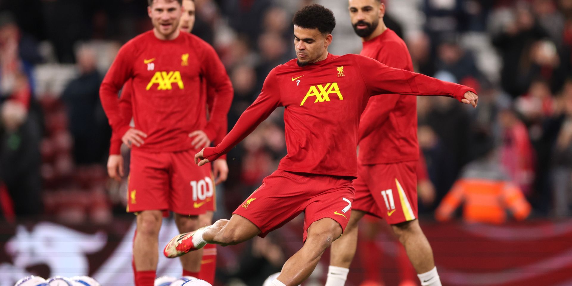 Luis Diaz warms up for Liverpool at Anfield