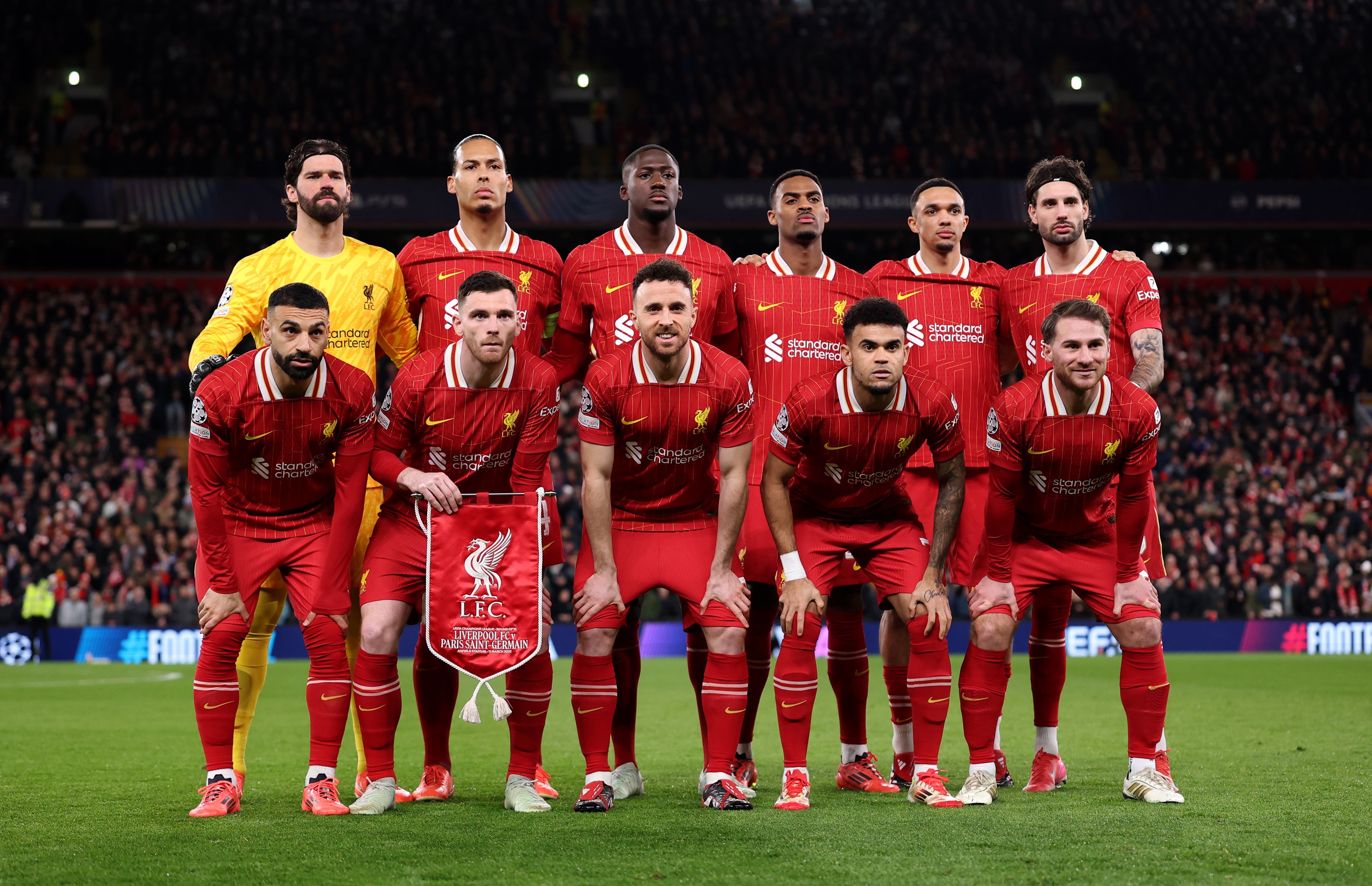 Dominik Szoboszlai and Liverpool players line up for team photo.