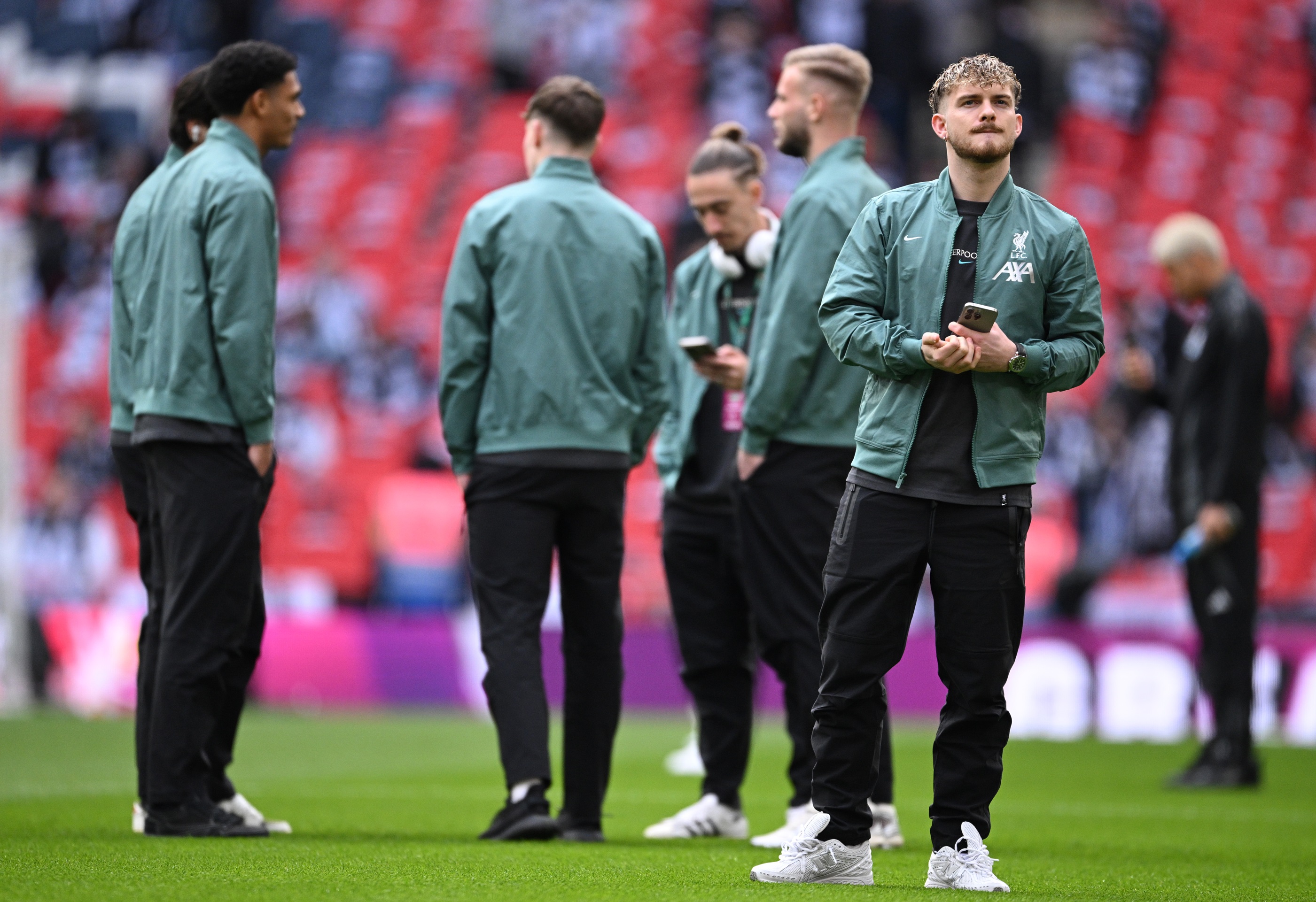 Harvey Elliott walks on the Wembley Stadium pitch.