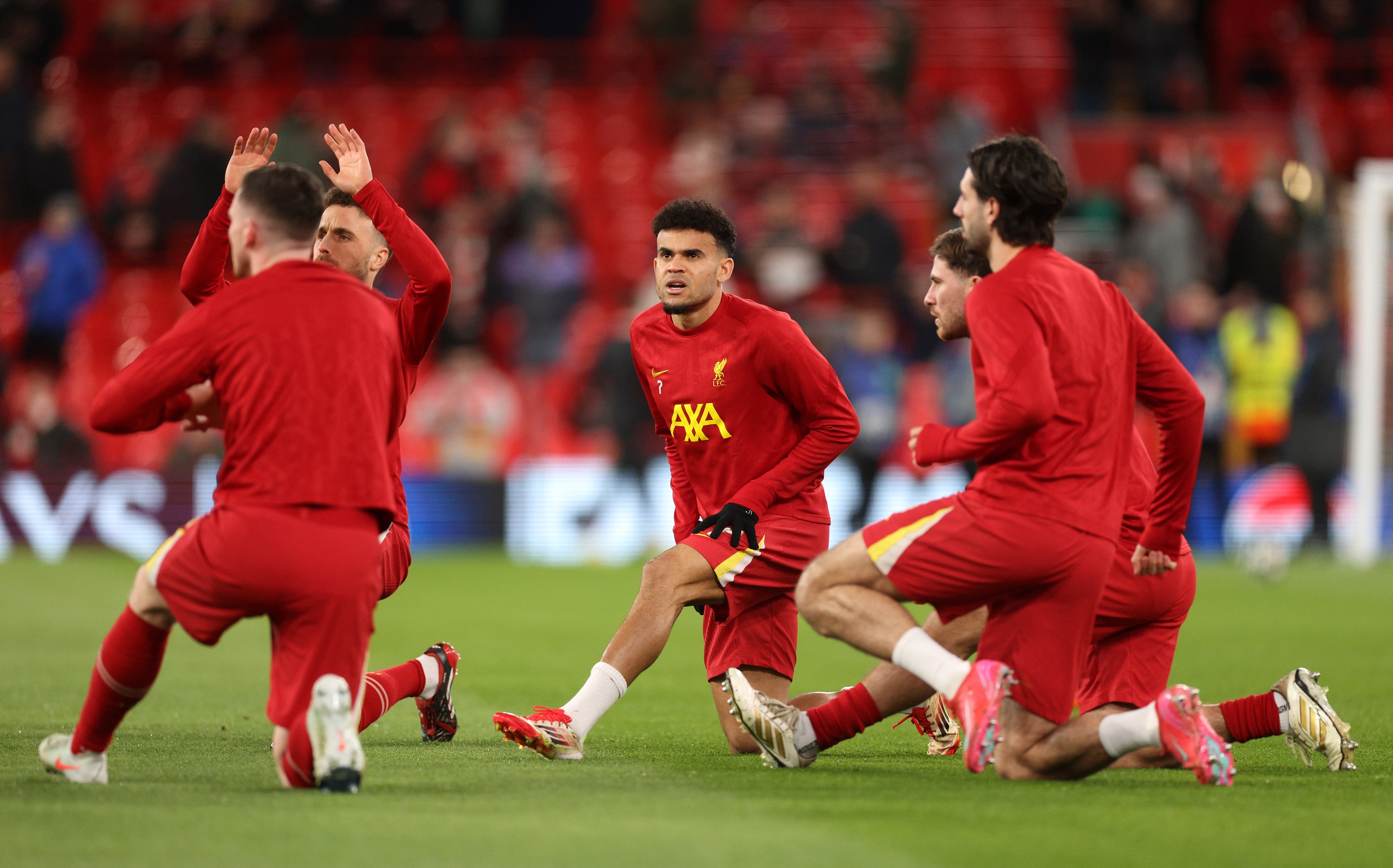Luis Diaz warms up ahead of PSG vs Liverpool.