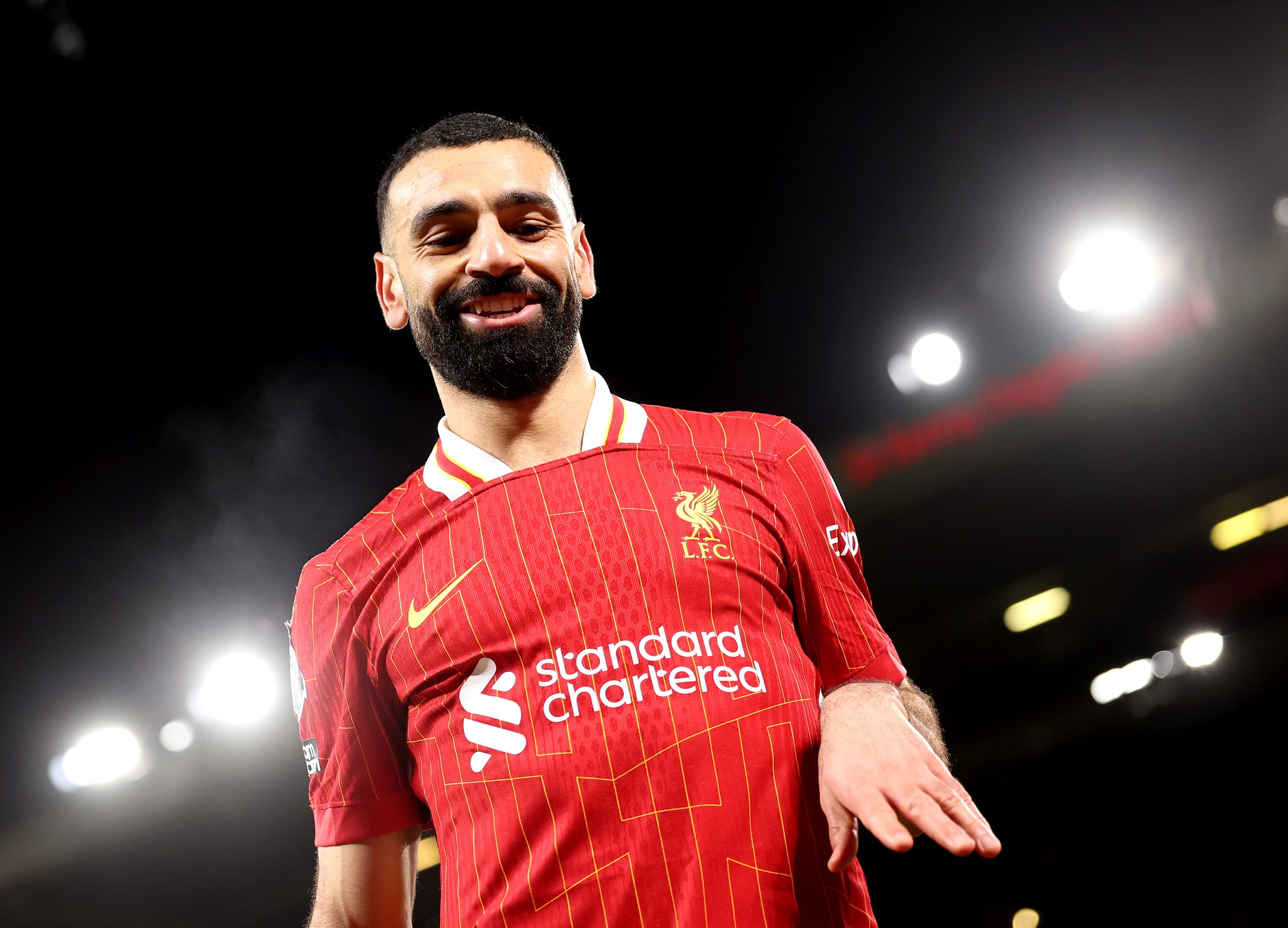 Mo Salah walks on St James Park turf.