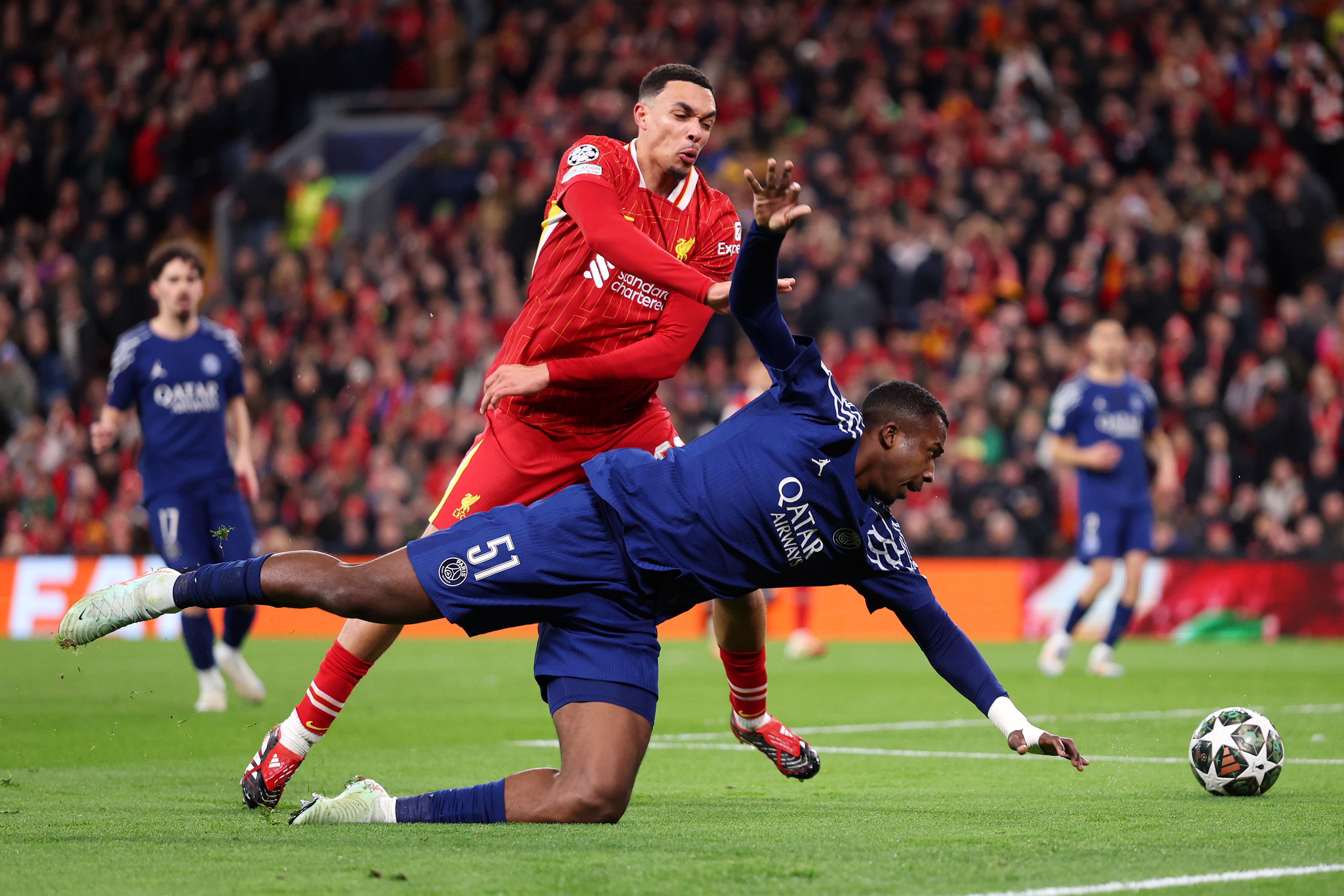 Trent Alexander-Arnold grapples with William Pacho.