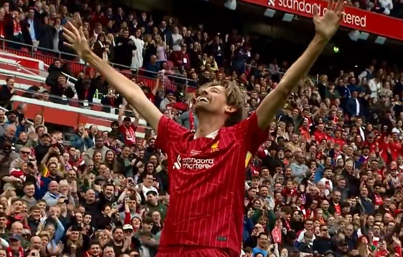 Peter Crouch celebrates in front of the Kop after scoring in the Liverpool Legends match