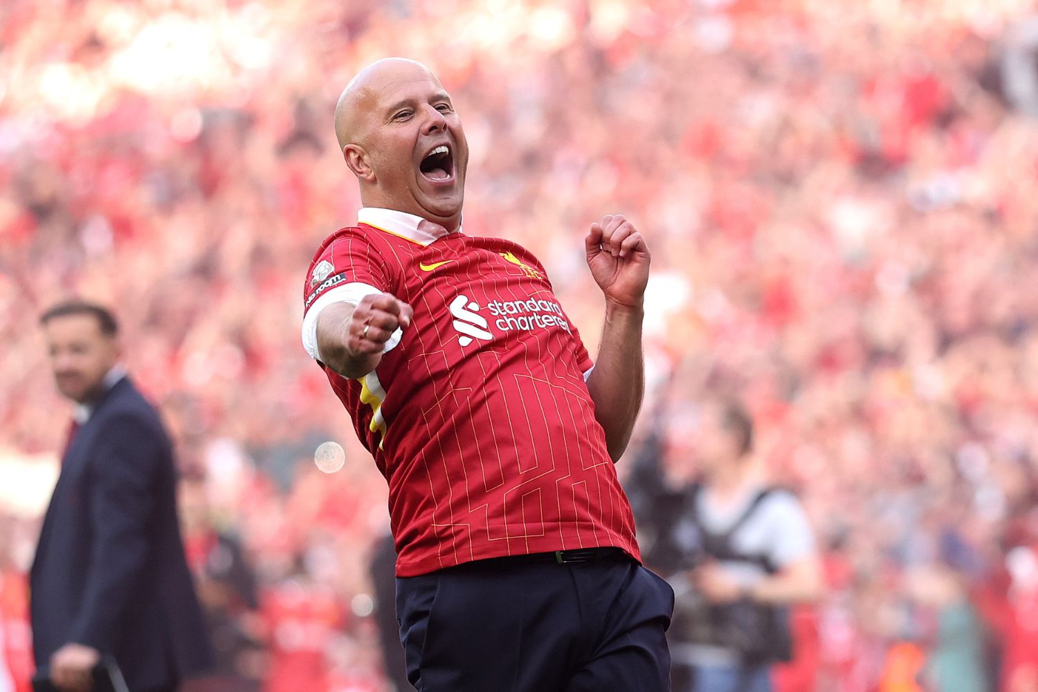 Arne Slot celebrates winning the league