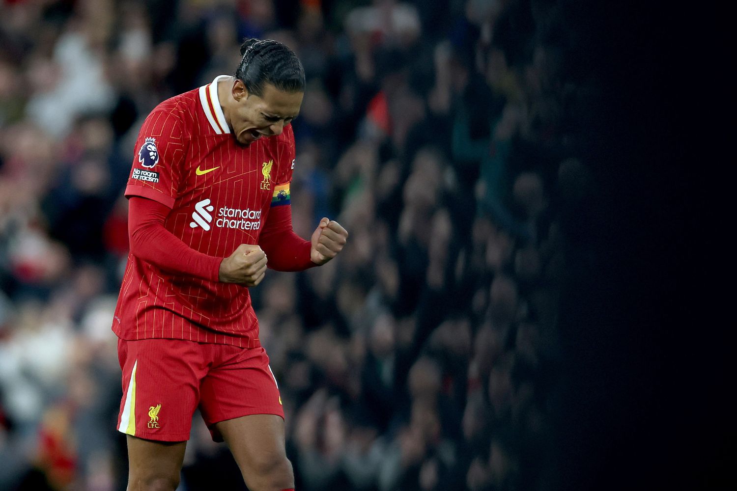 Virgil van Dijk celebrates at Anfield as Liverpool captain