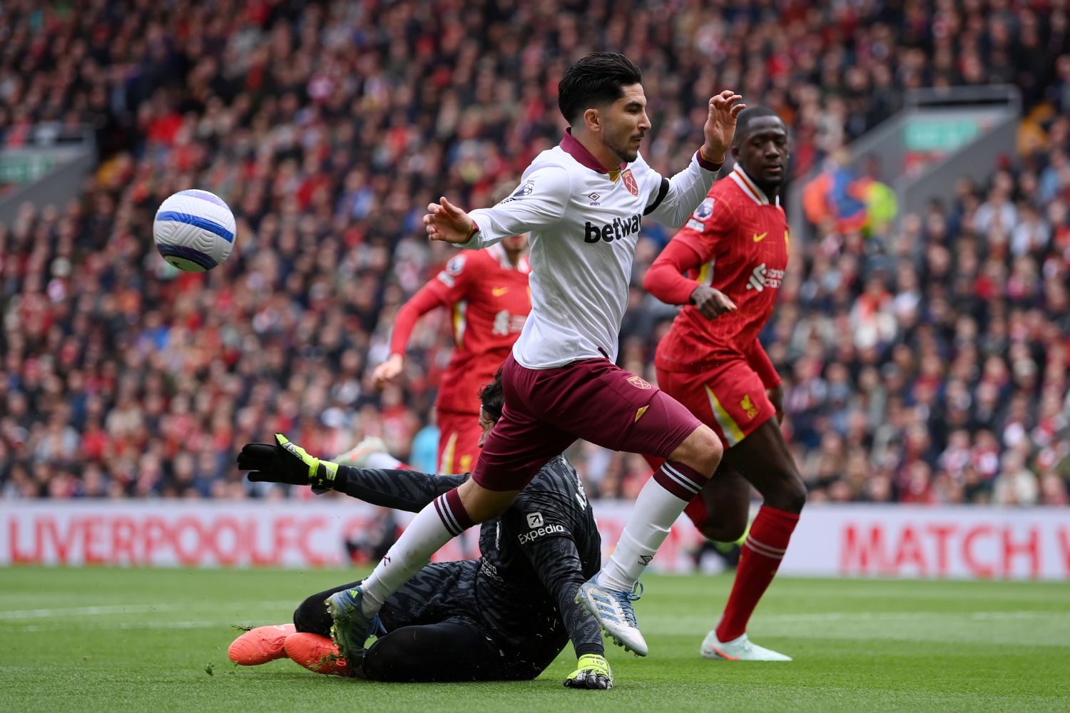 Alisson Becker saves against West Ham
