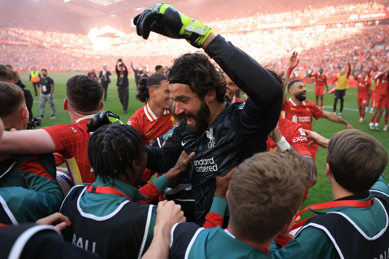 Alisson celebrates winning the league