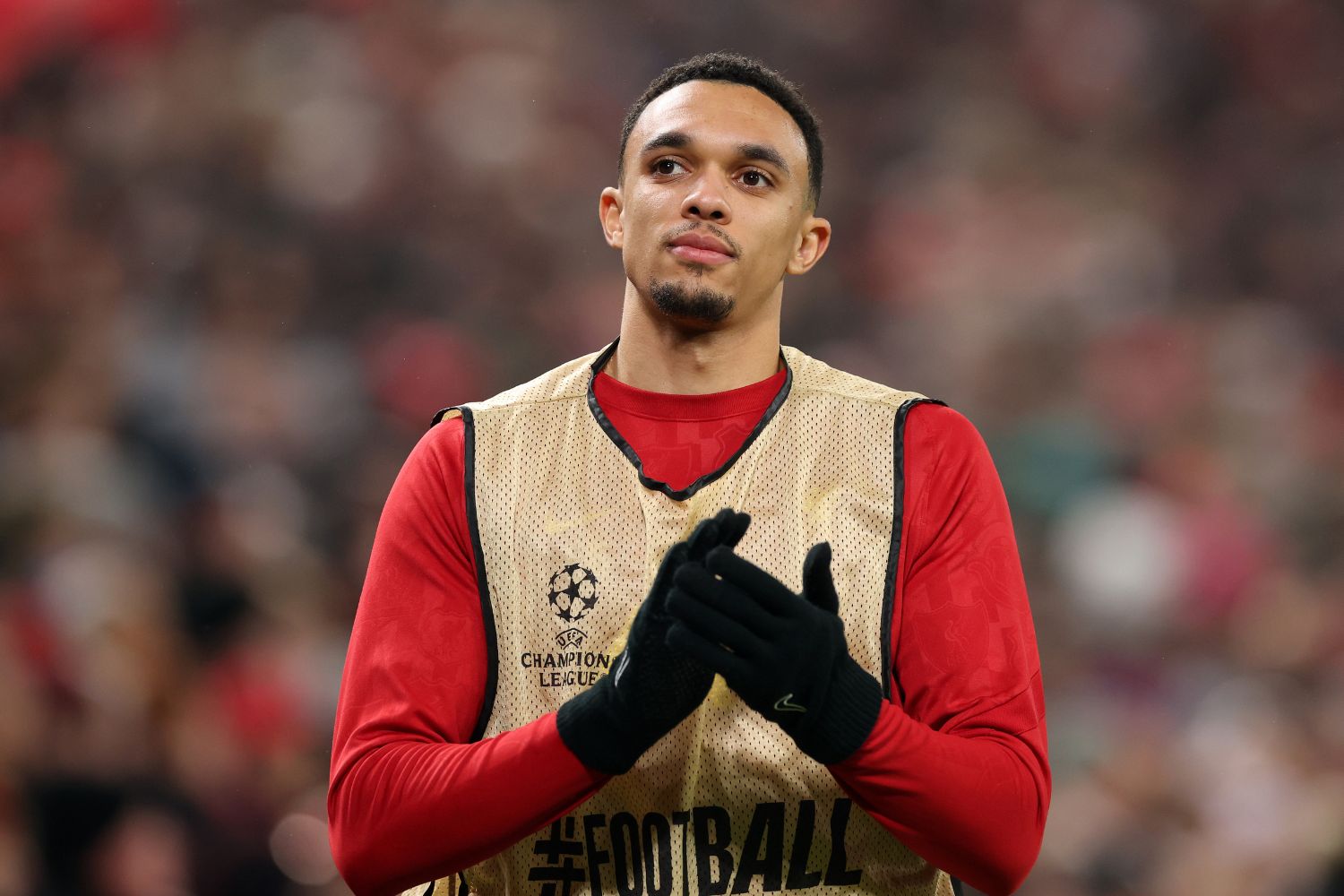 Trent Alexander-Arnold warms up on the sidelines