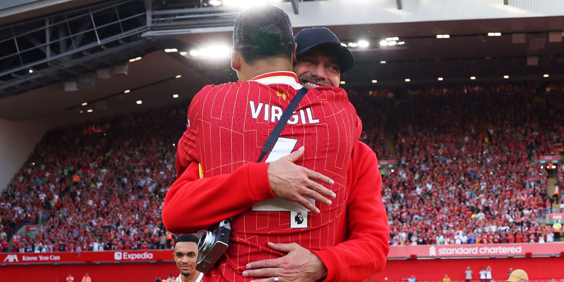 Jurgen Klopp and Virgil van Dijk embrace at Anfield