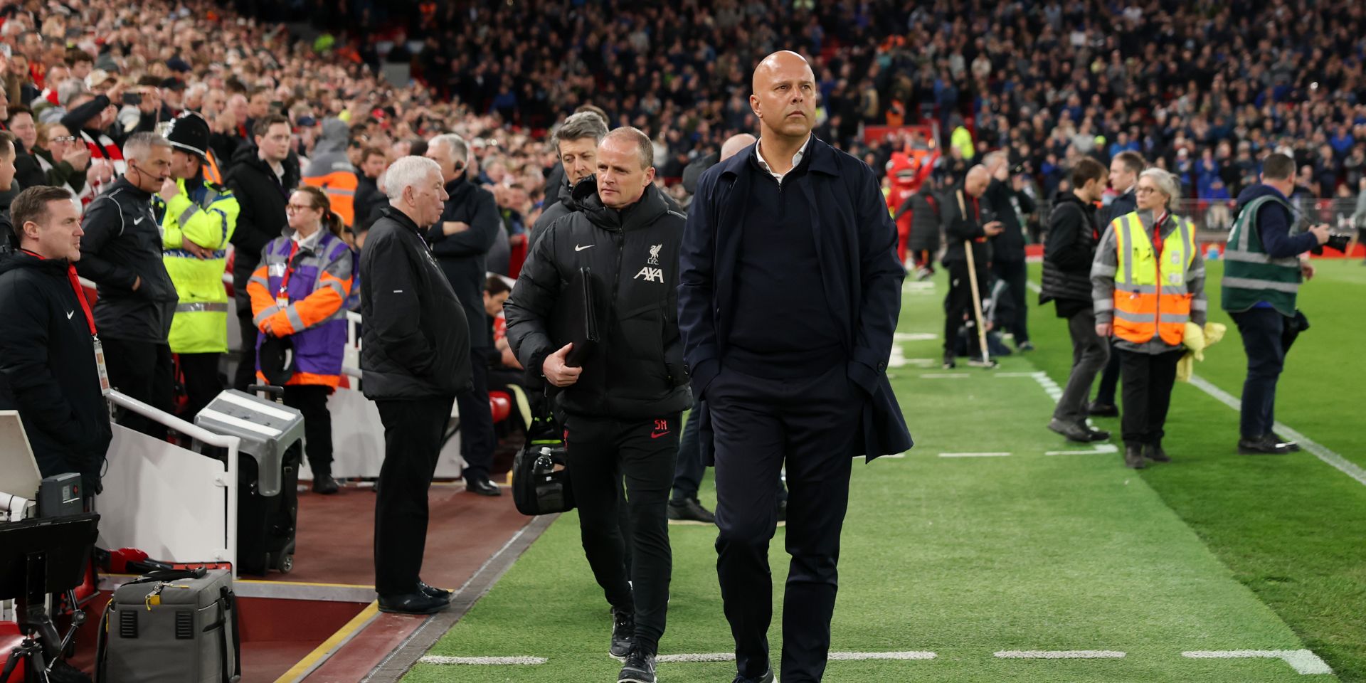 Arne Slot walking down the touchline at Anfield