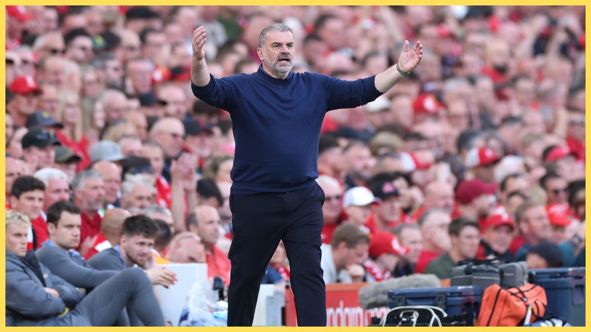 Ange Postecoglou holds up his arms during Liverpool game.