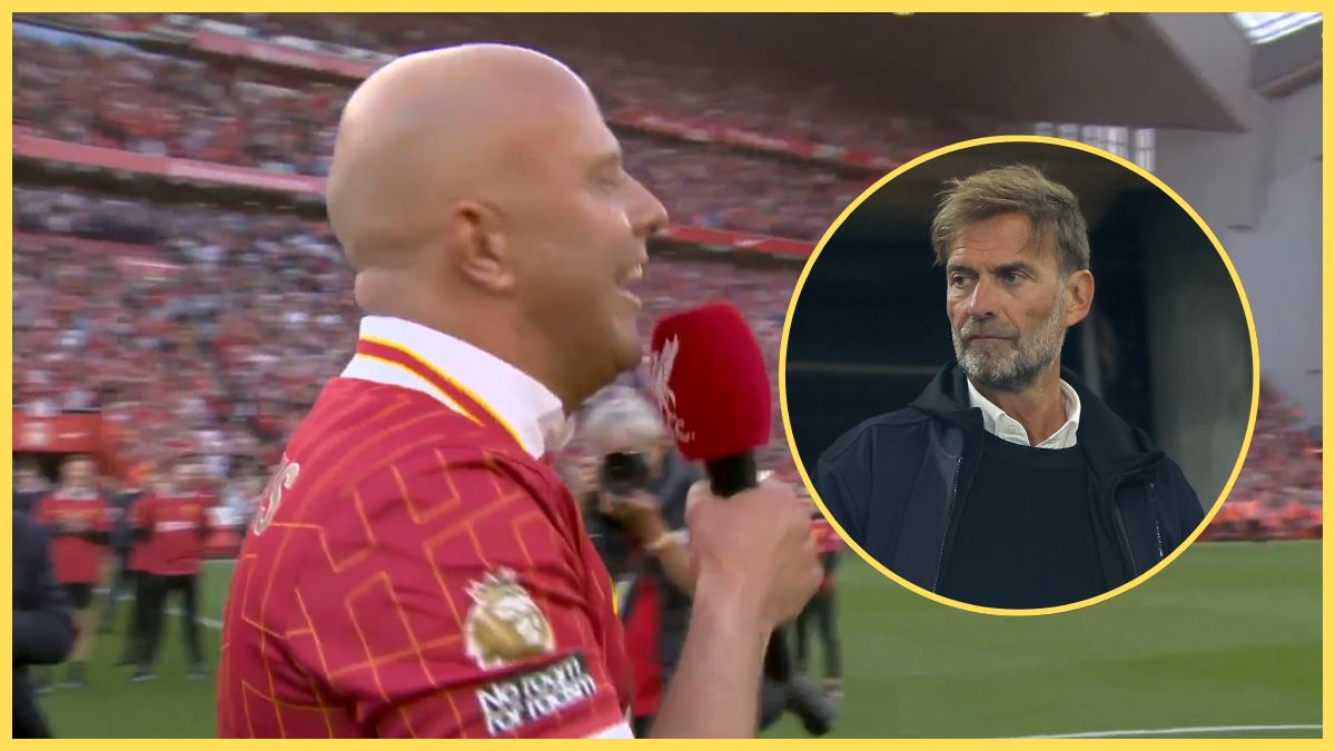 Arne Slot holds a microphone next to Jurgen Klopp.