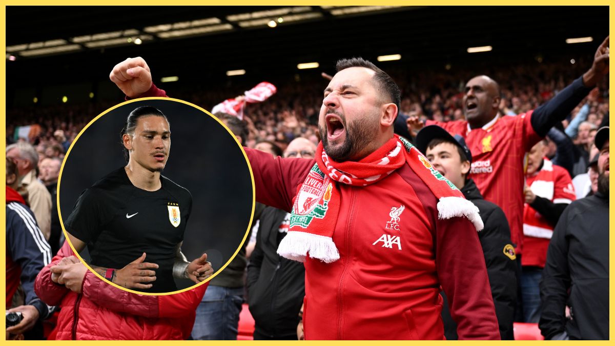 Liverpool fans raise their arms next to Darwin Nunez.