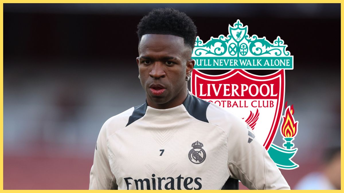 Vinicius Jr stands in Real Madrid training shirt in front of Liverpool club crest.