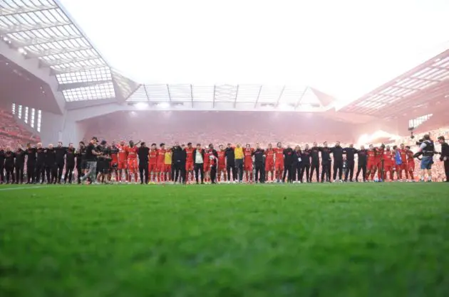 Liverpool players celebrate at Anfield after winning the Premier League