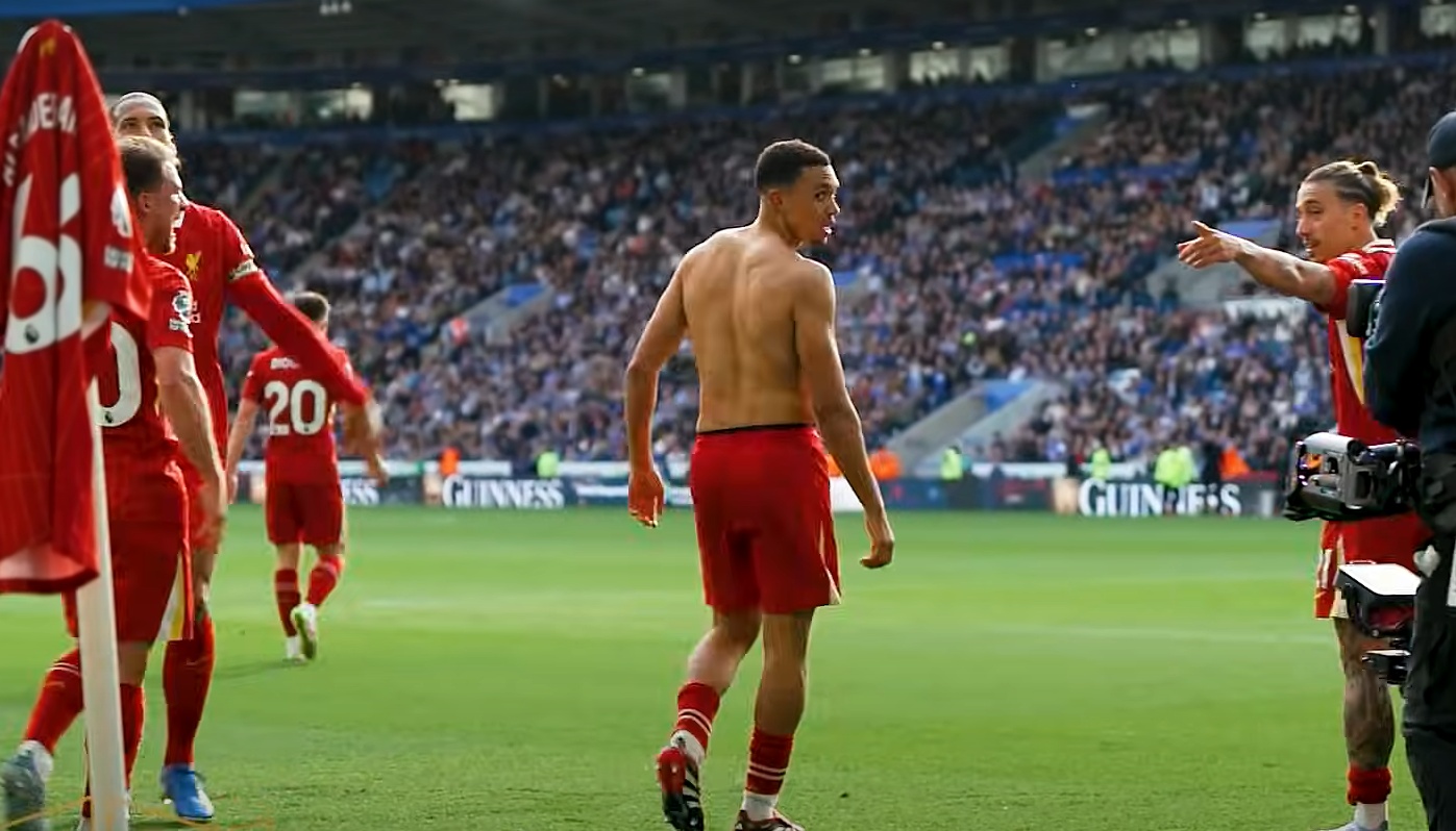 Kostas Tsimikas reminds Trent Alexander-Arnold to retrieve his shirt from the corner flag