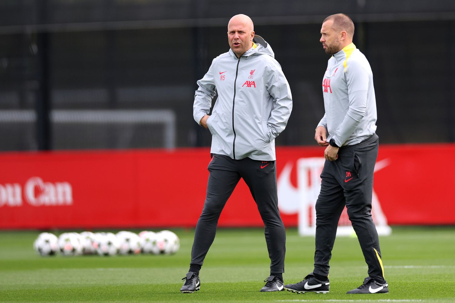 Johnny Heitinga oversees Liverpool training