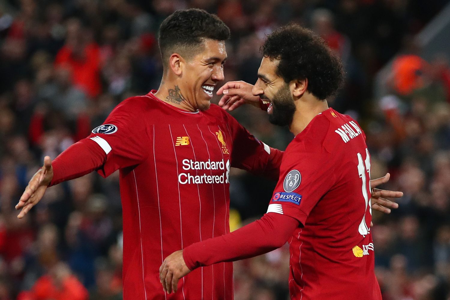 Bobby Firmino and Mo Salah celebrate together