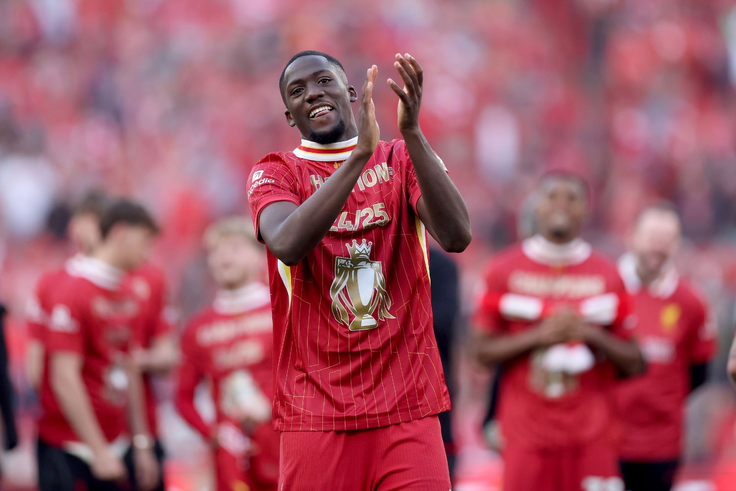 Ibou Konate celebrates winning the league at Liverpool