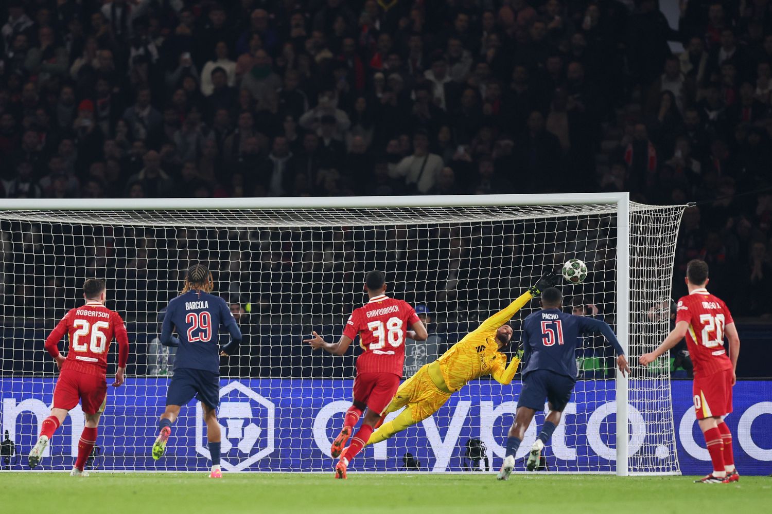 Alisson Becker makes a save for Liverpool against PSG