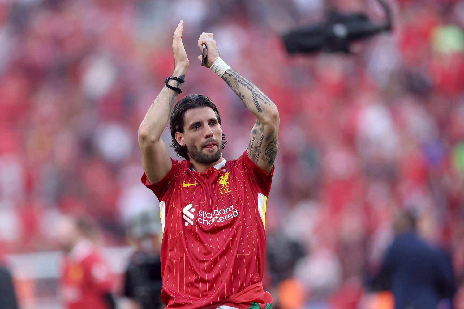 Dominik Szoboszlai applauds the Liverpool fans