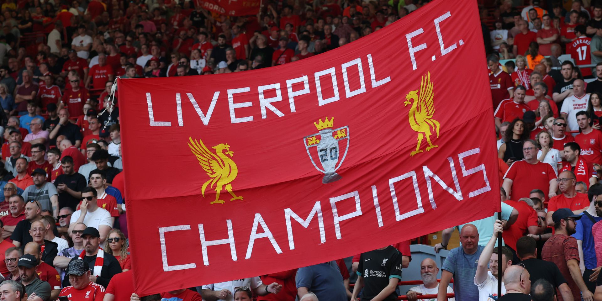 Liverpool fans display a champions banner