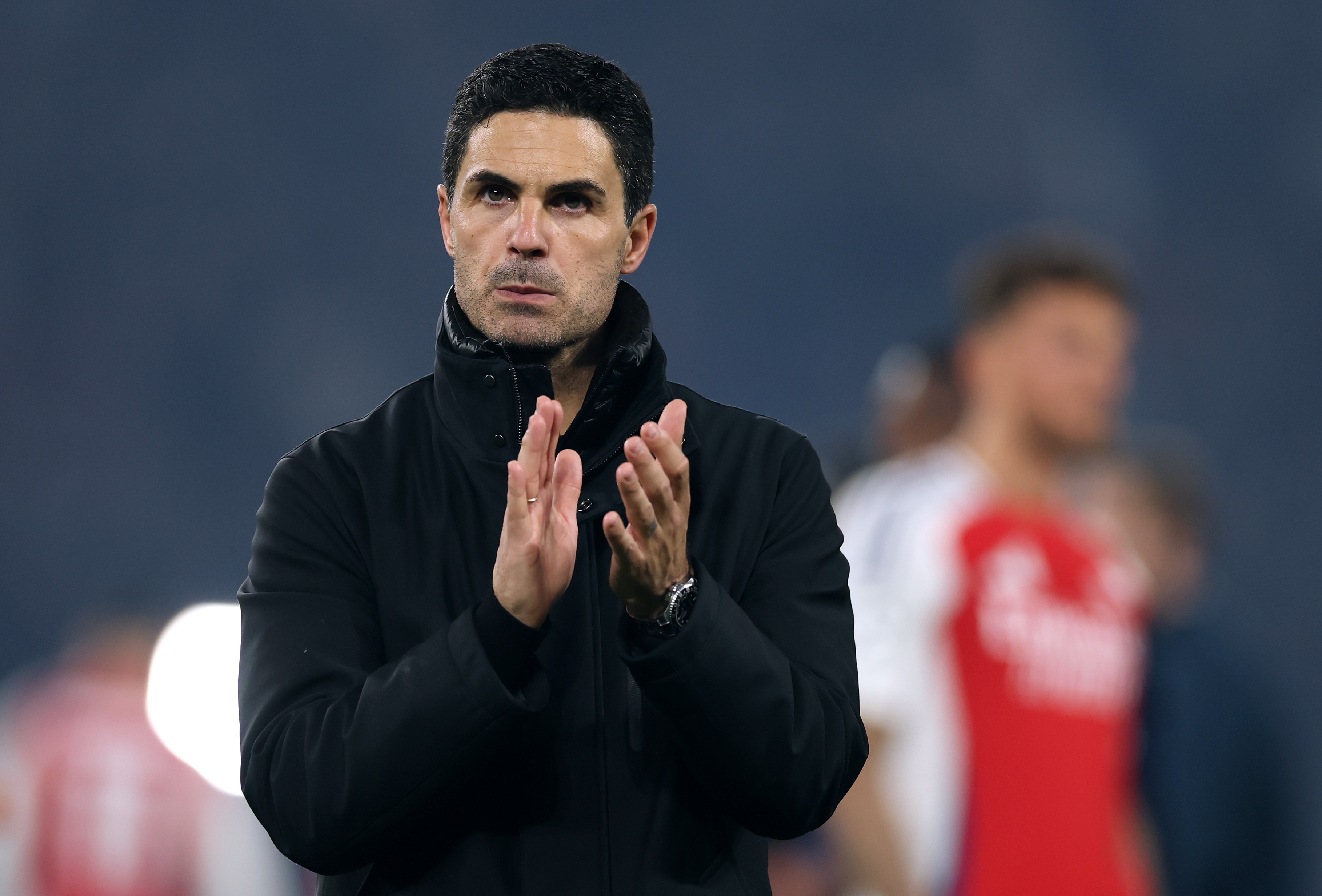 Mikel Arteta looks upset as he claps his hands in Paris.