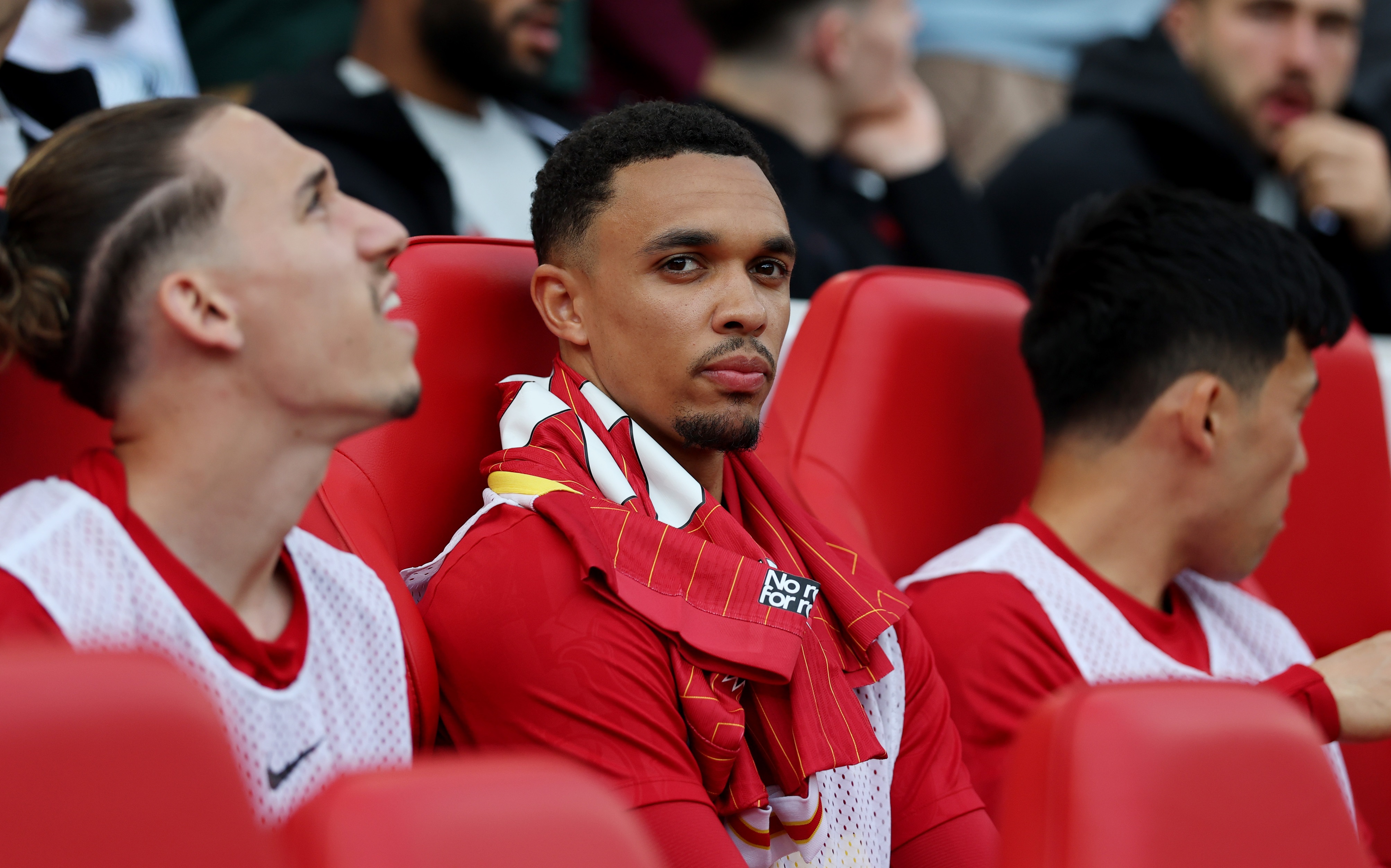 Trent Alexander-Arnold looks on from the Liverpool bench.