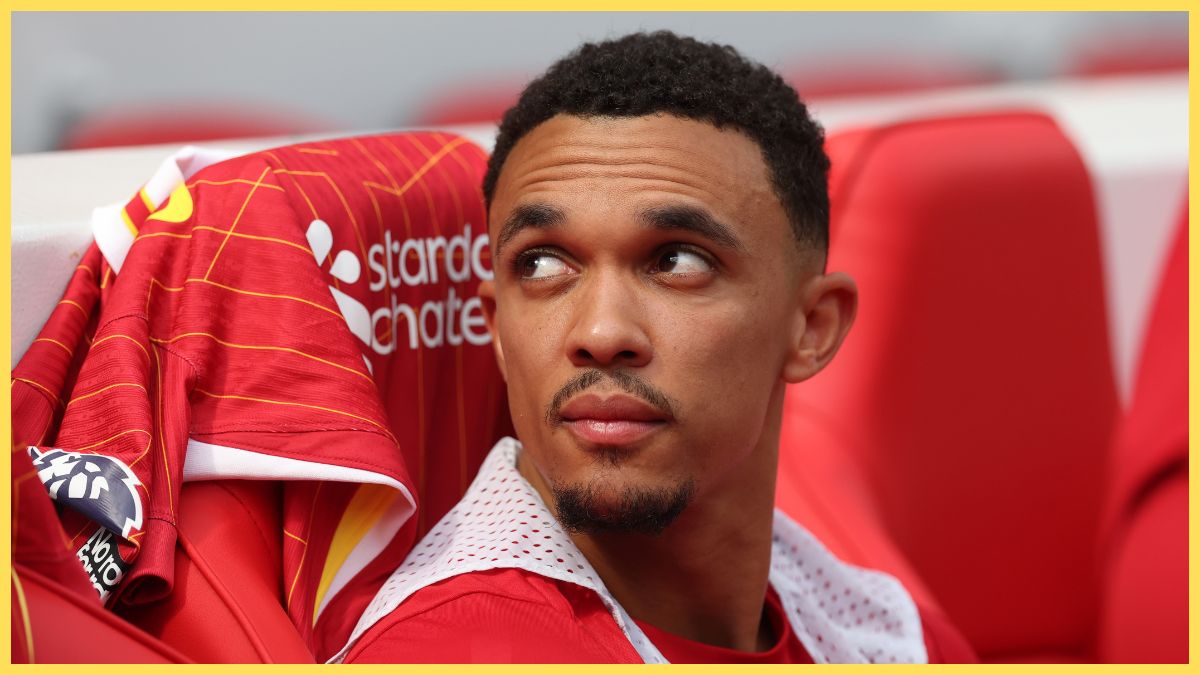 Trent Alexander-Arnold looks up at Liverpool fans from the bench.