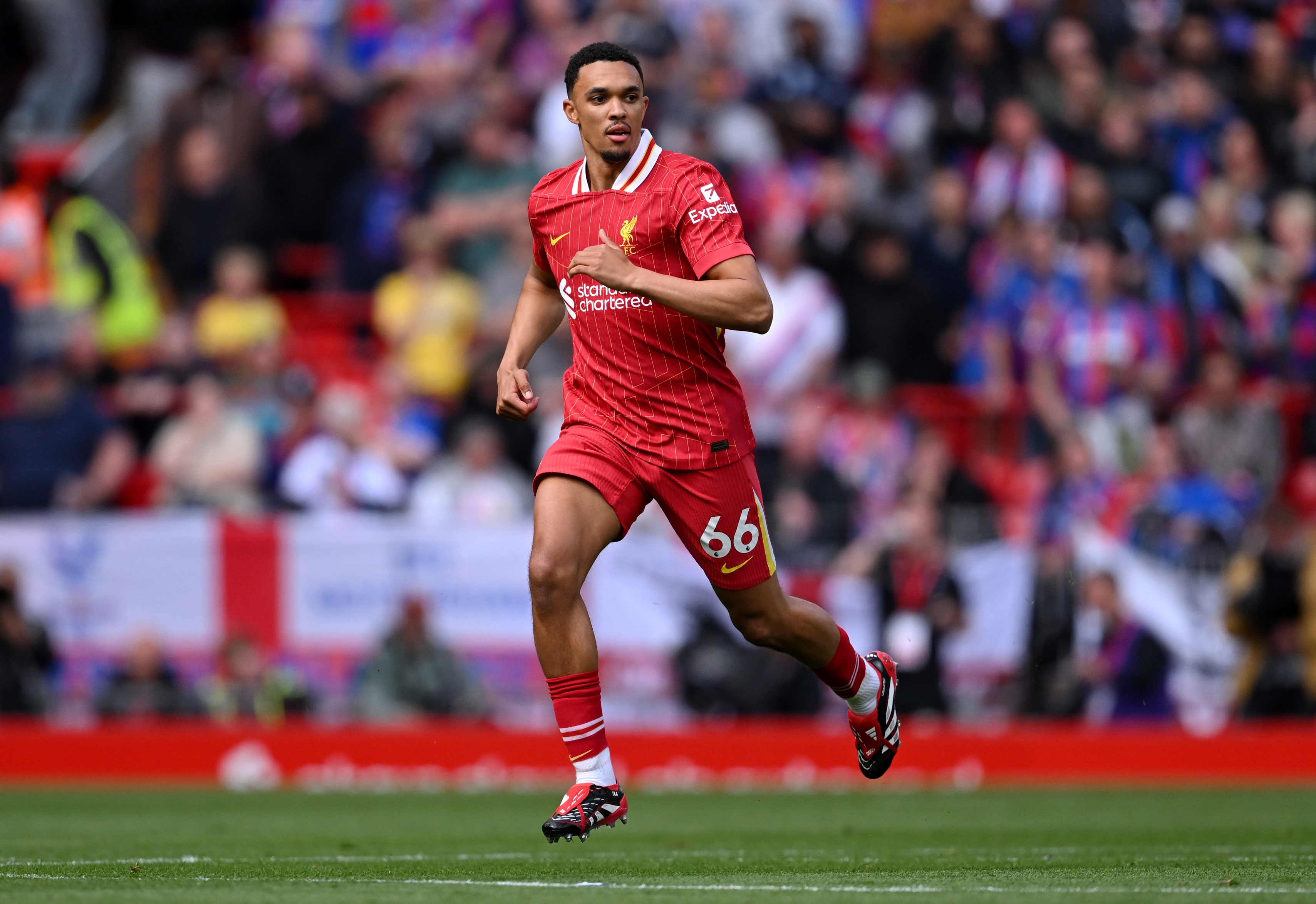 Trent Alexander-Arnold runs on the pitch at Anfield.