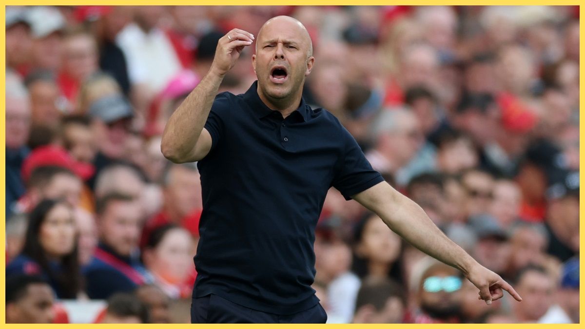 Liverpool head coach Arne Slot gestures with his hands from the sideline.