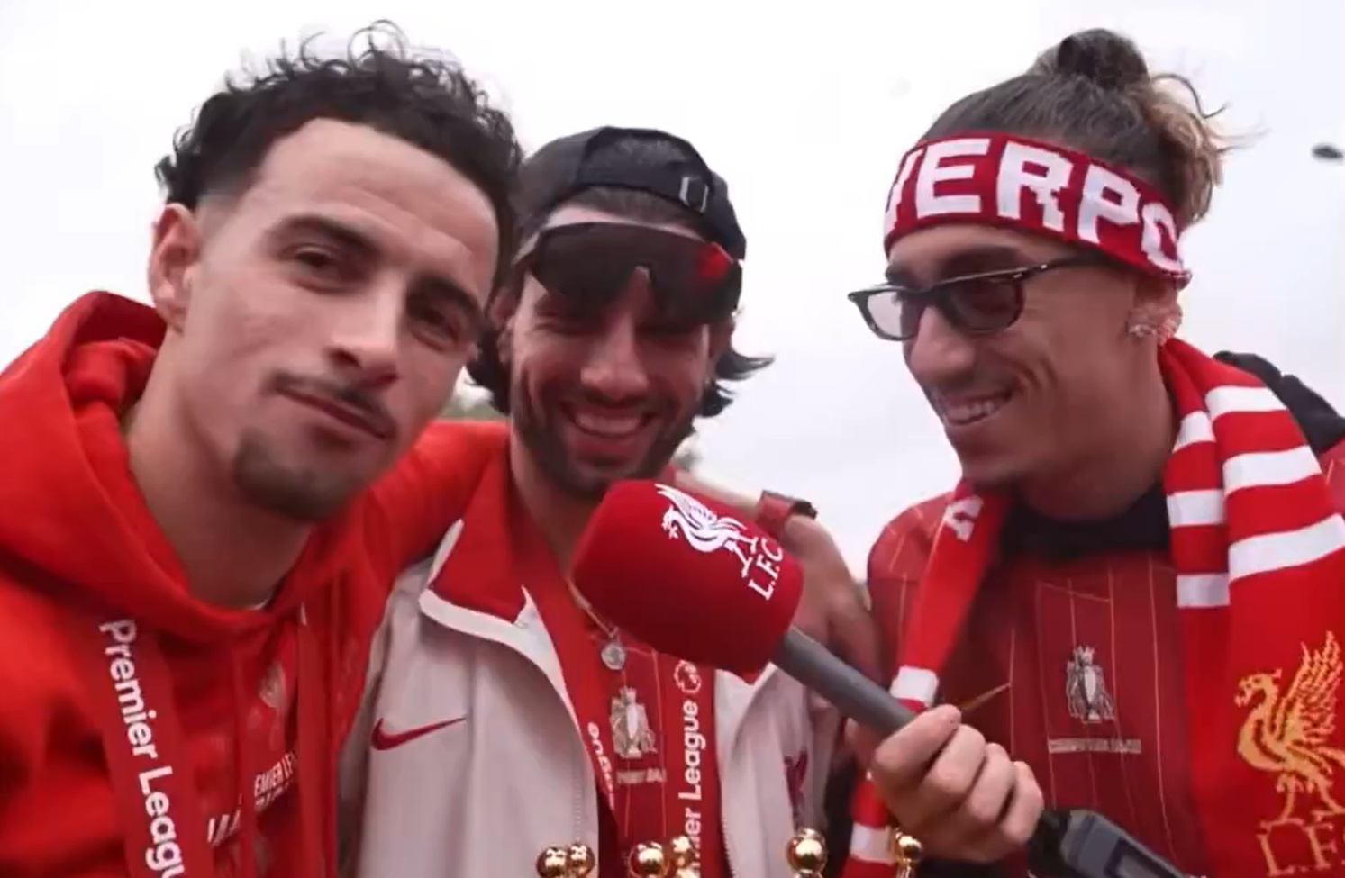 Curtis Jones, Dominik Szoboszlai and Kostas Tsimikas enjoy Liverpool's open-top bus parade
