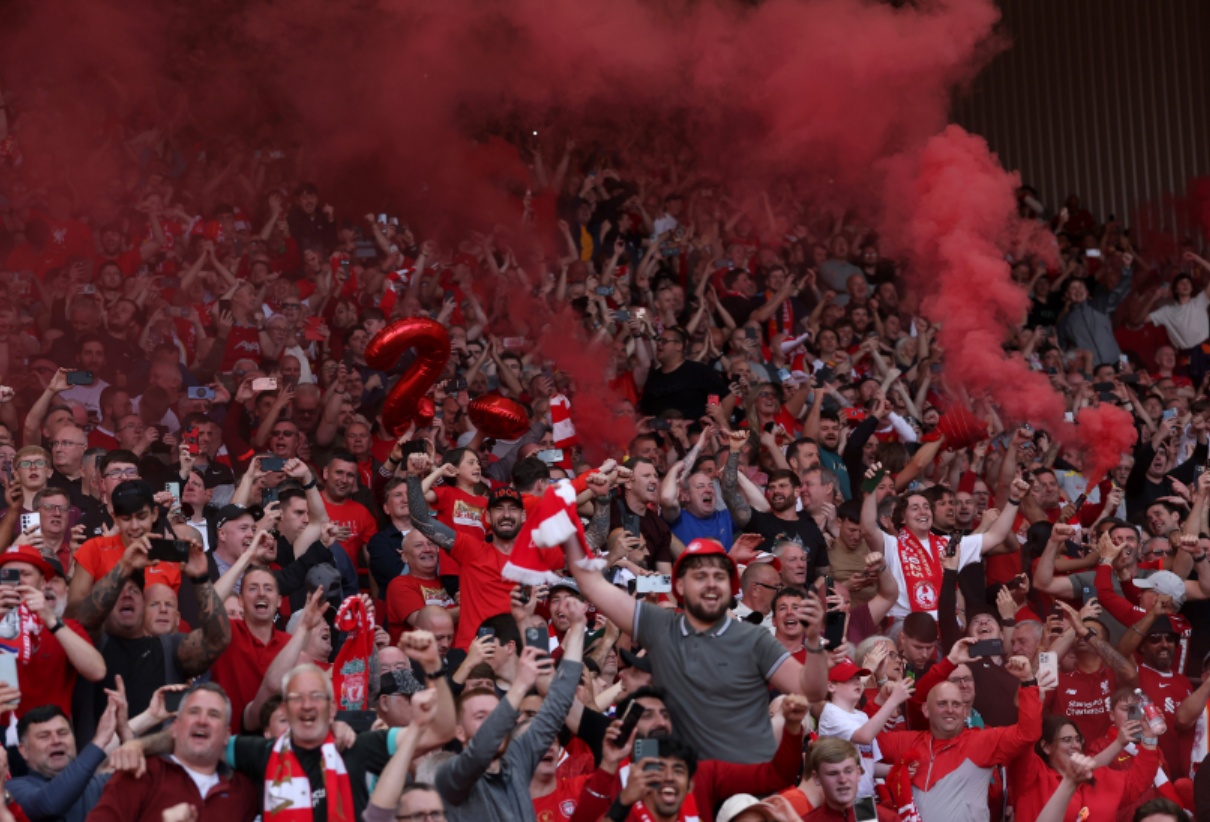 Liverpool fans celebrate at Anfield after the Reds won the Premier League title